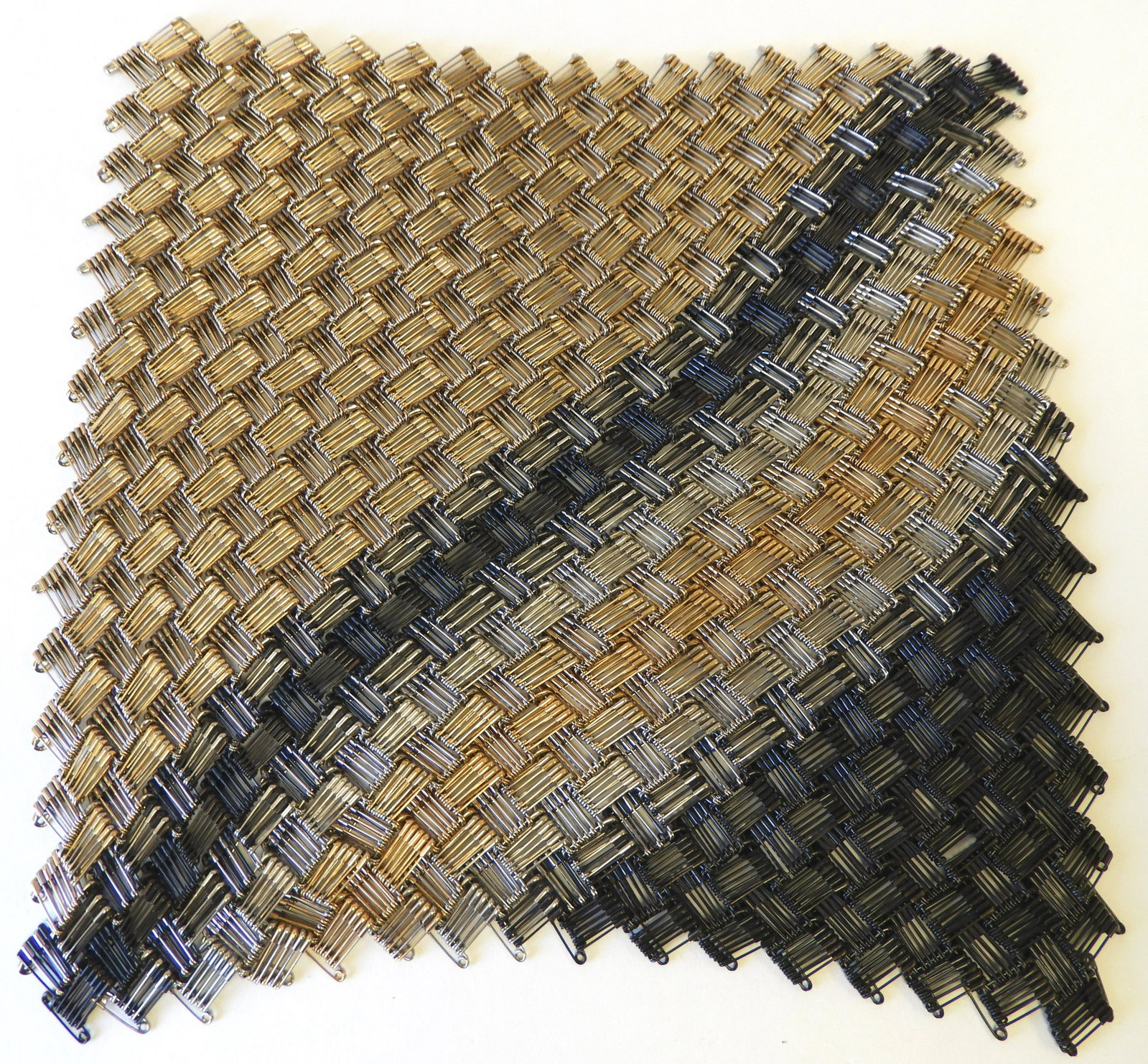 Tamiko Kawata, "Mountain Wave" Flexible Square: Tamiko Kawata Ferguson (Japan, b. 1936). Flexible square titled "Mountain Wave" composed of 24K plated yellow gold, oxidized, and nickel plated safetypins. (NN9000)(EL)