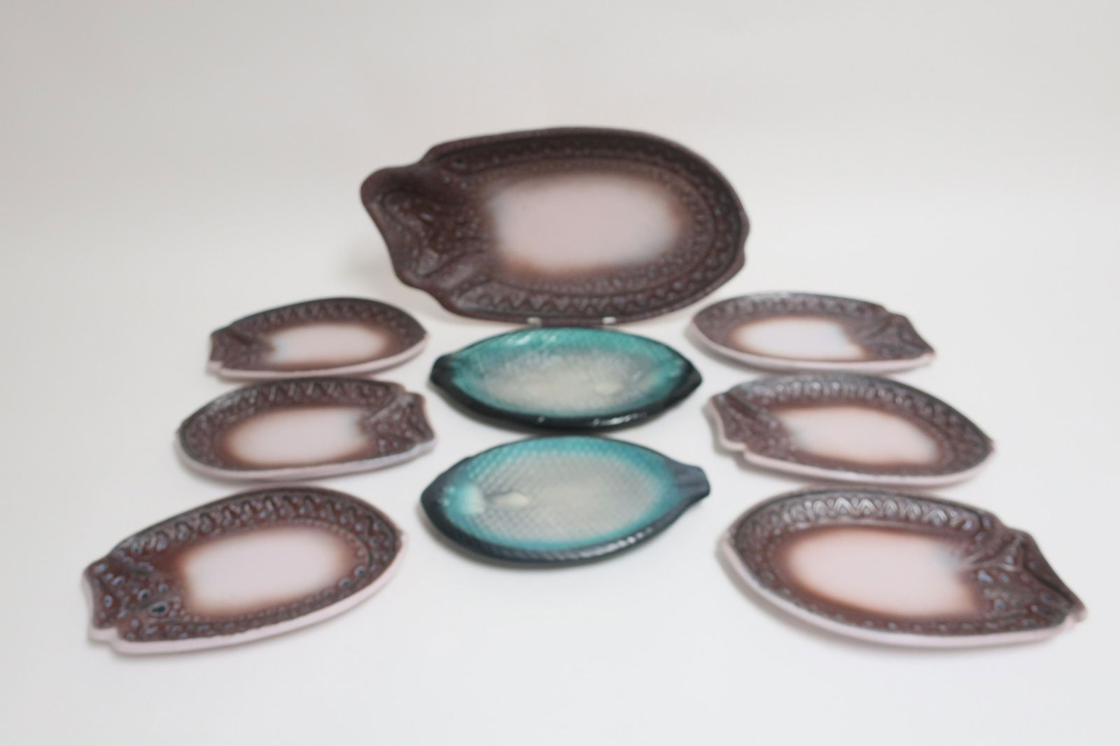 8 Ceramic Fish Plates, Austen, Chambost: 6-pc. Ceramic Fish Plates by Jean Austen and 2 Ceramic Fish Plates by Pol Chambost The largest 19 1/4" W Property from the Estate of an Important New York Modernism Dealer. (NJWA180/8)(MS)