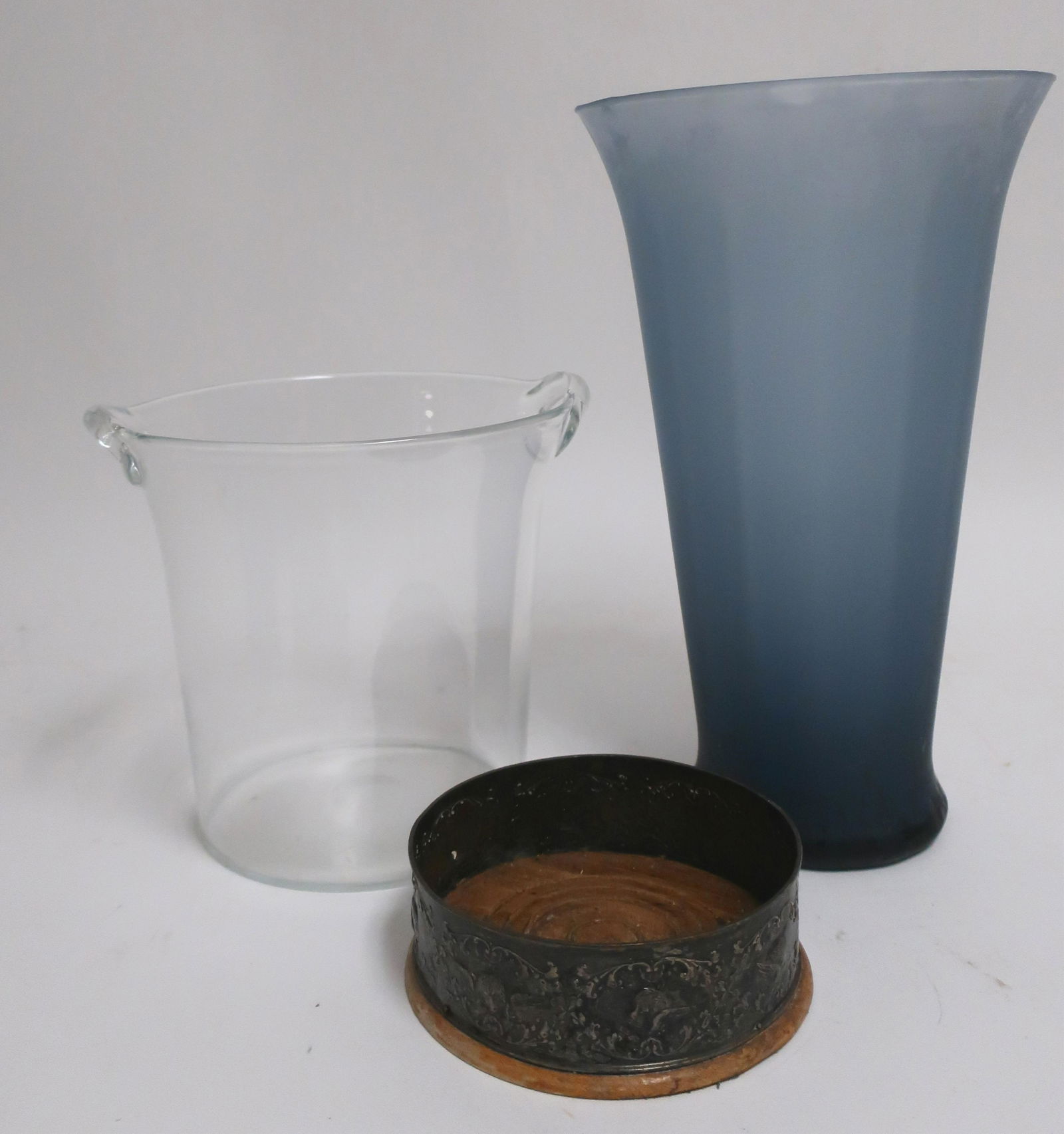 Roth: Vase Sterling Wine Coaster, Orrefors Bucket: A blue glass vase, an English Sterling Silver wine coasted with London marks, probably 19th c., and a signed Orrefors wine bucket blue vase 12.5" H, Orrefors 7.75" H x 7.75" diameter, coaster Property