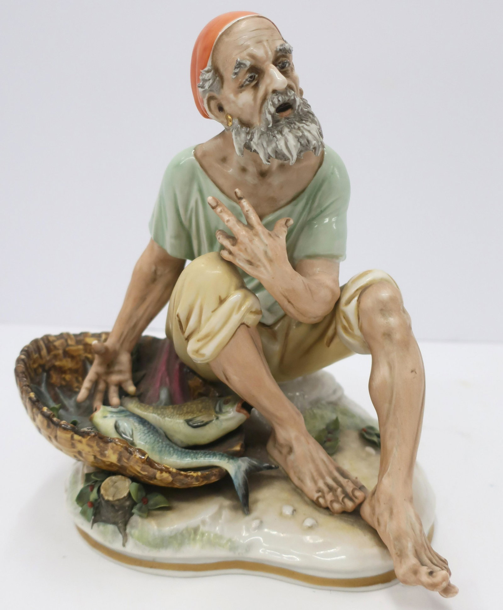 Sandizell (Germany) Fish Monger Porcelain Figure: marked on bottom Dimensions: 10"H (QDRIC142)(JP)