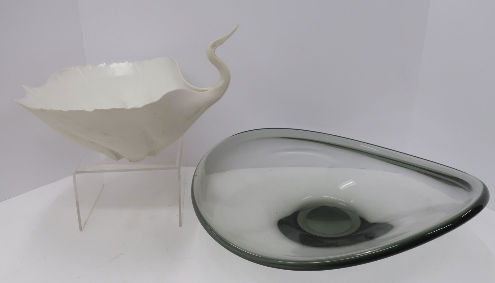 2 Decorative Bowls - Holmegaard: Applied medium to shell to create bird form, signed Deha(?) Suamya(?) (illegible). Glass signed Holmegaard 1952. Dimensions: glass 4.5"H x 15 dia. (QDRIC158/2)(JP)