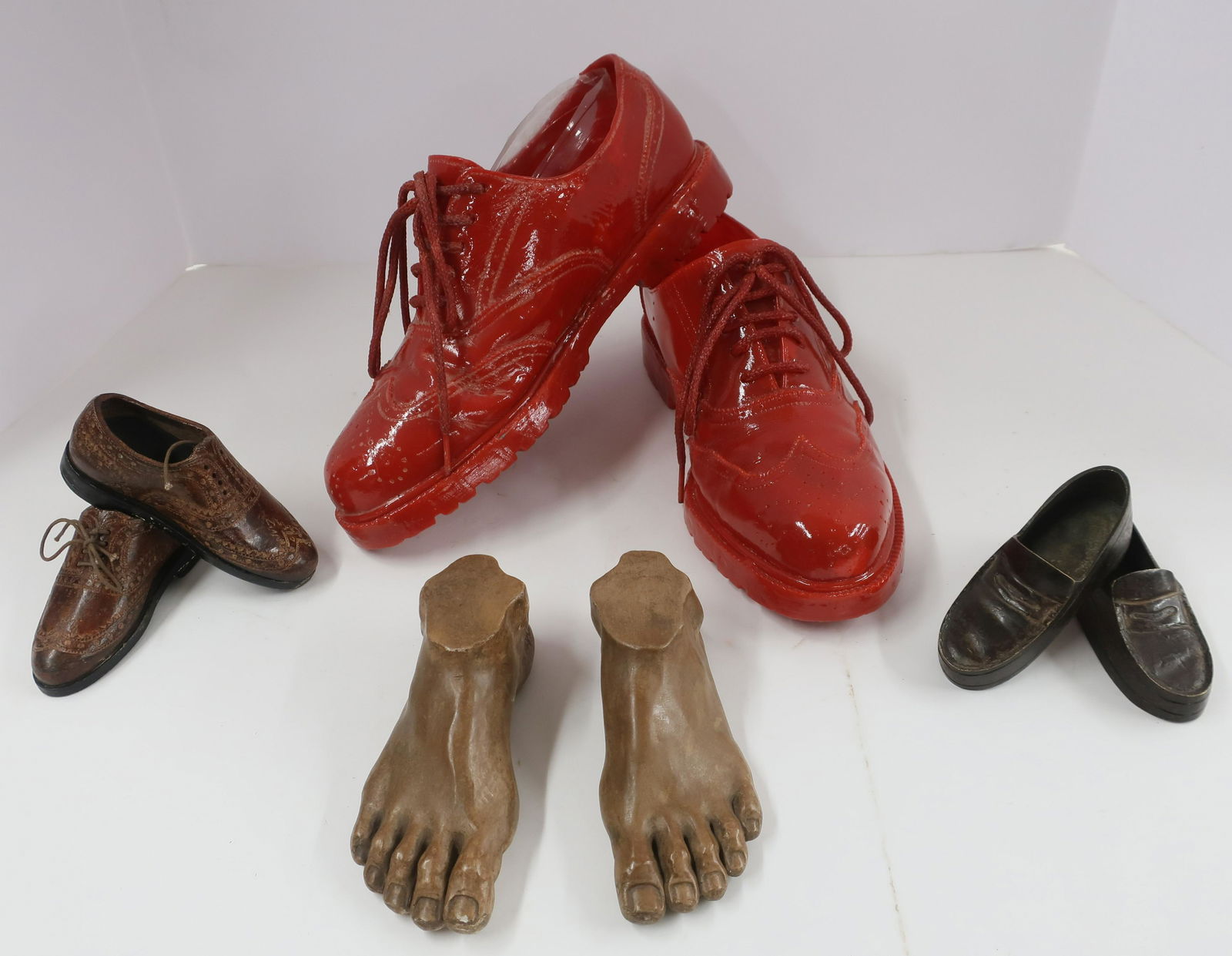 4 Pairs Shoes & Feet: 4 Pairs Shoes & Feet, red plastic, 2 pair miniature metal and bronze and composition feet (8 pc.) Dimensions: Red 11 1/2" L , metal shoes 5" L x 4 1/2" L, Mar Co Feet 6" L (EBAZ1080/8)(WT)