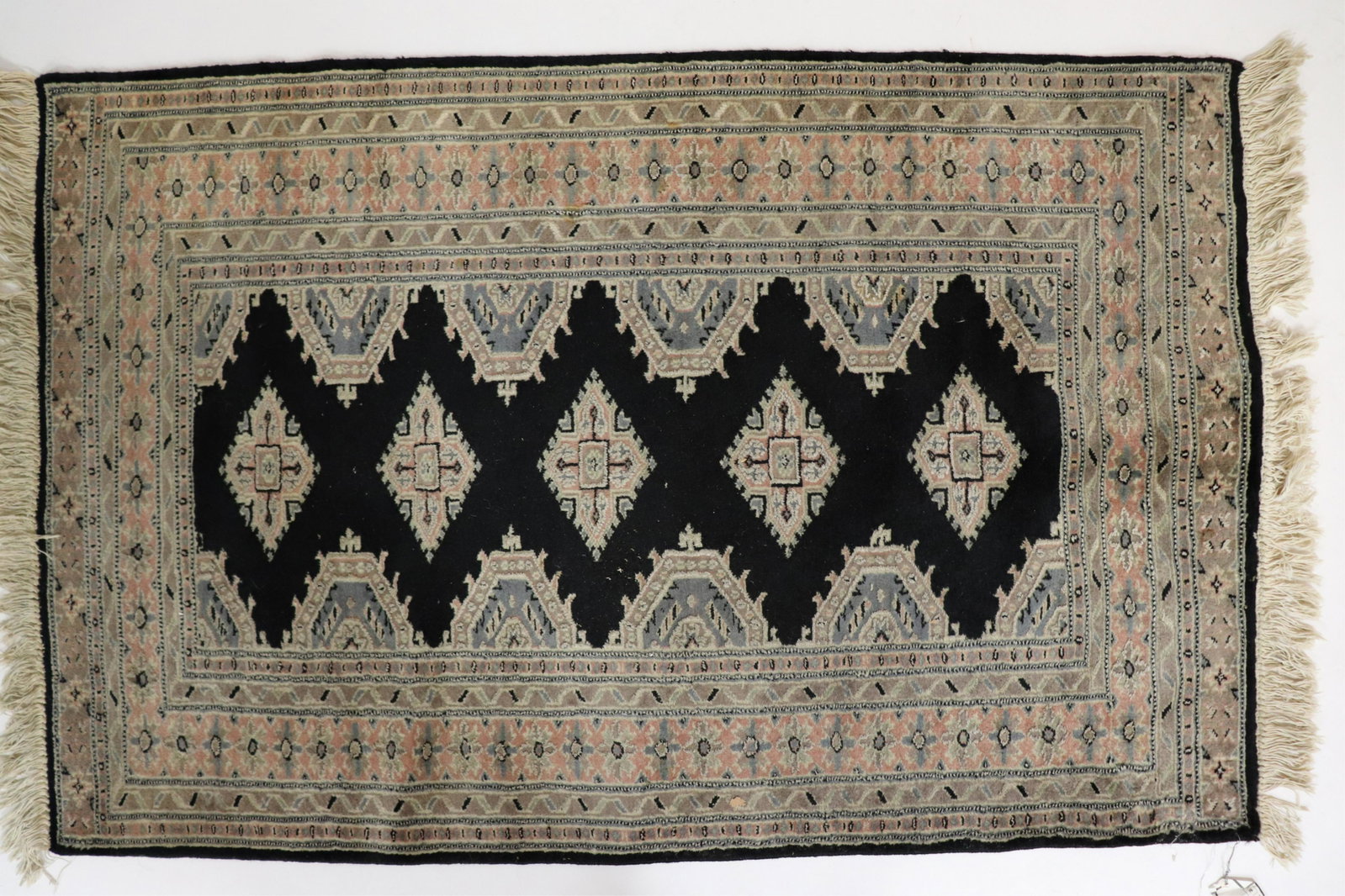 Bokhara Caucasian Style Wool Rug: Made in Pakistan. Originally purchased at Bloomingdale's. Dimensions: 3'2" x 4'10 (ALVA1135)(JP)