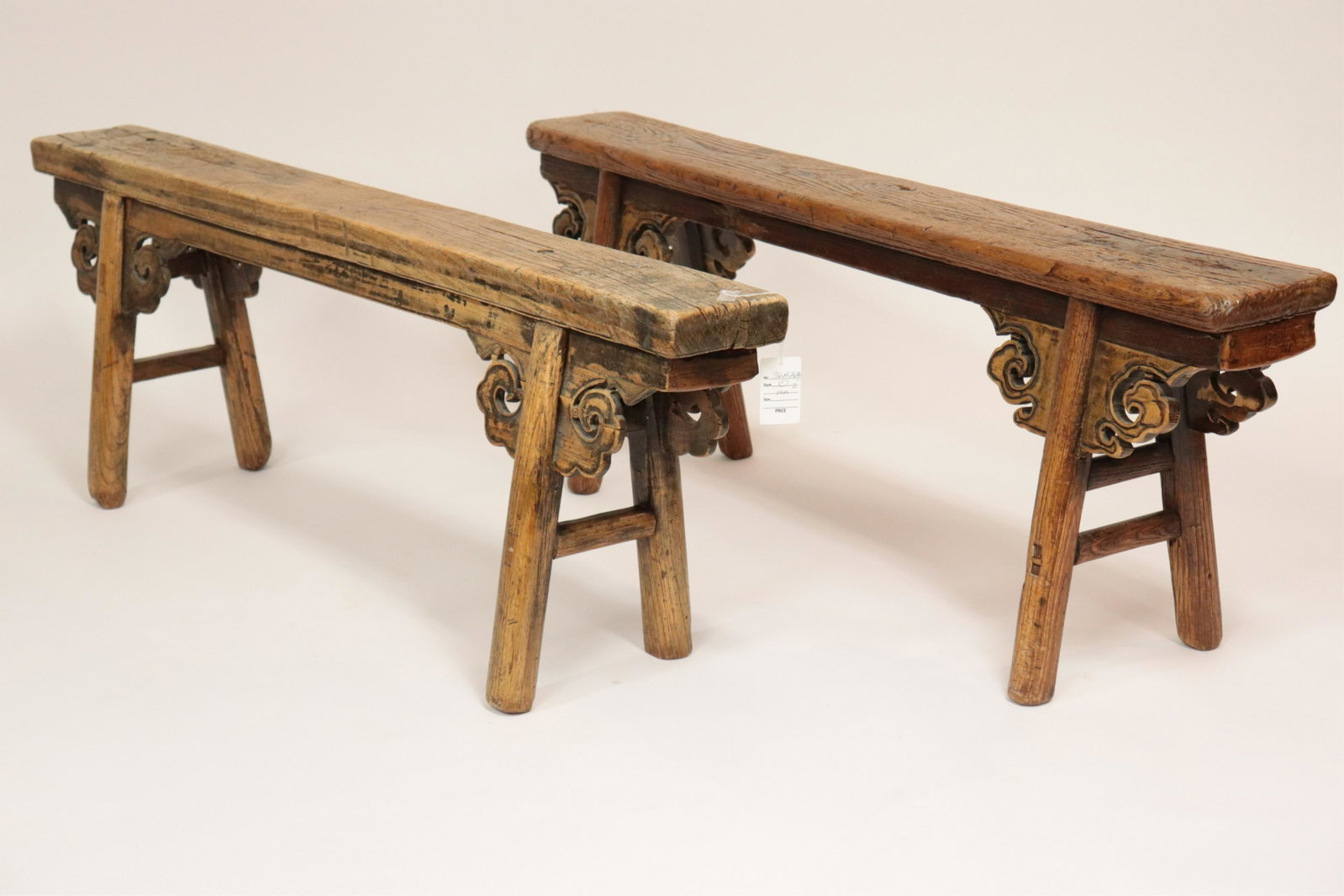 Near Pair of Asian Carved Wooden Benches: Near Pair of Asian Carved Wooden Benches, marked to underside (SSWA2636)(MM) Dimensions: 19 1/2"H x 53"W x 13"D
