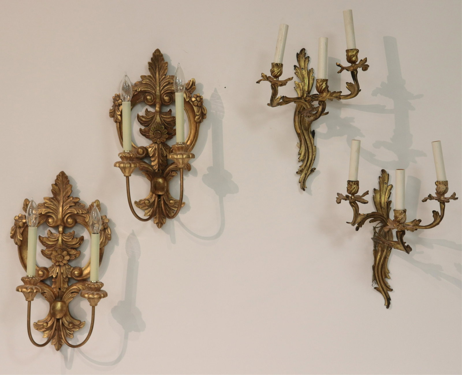 2 Pairs of Regency Metal and Giltwood Wall Scones: Regency Metal 3 Light scone with scrolled acanthus form along with a pair of carved giltwood scroll form, metal arms (SDAY2646/4)(MM) Dimensions: 19 1/2 x 15 and 11" x 12"