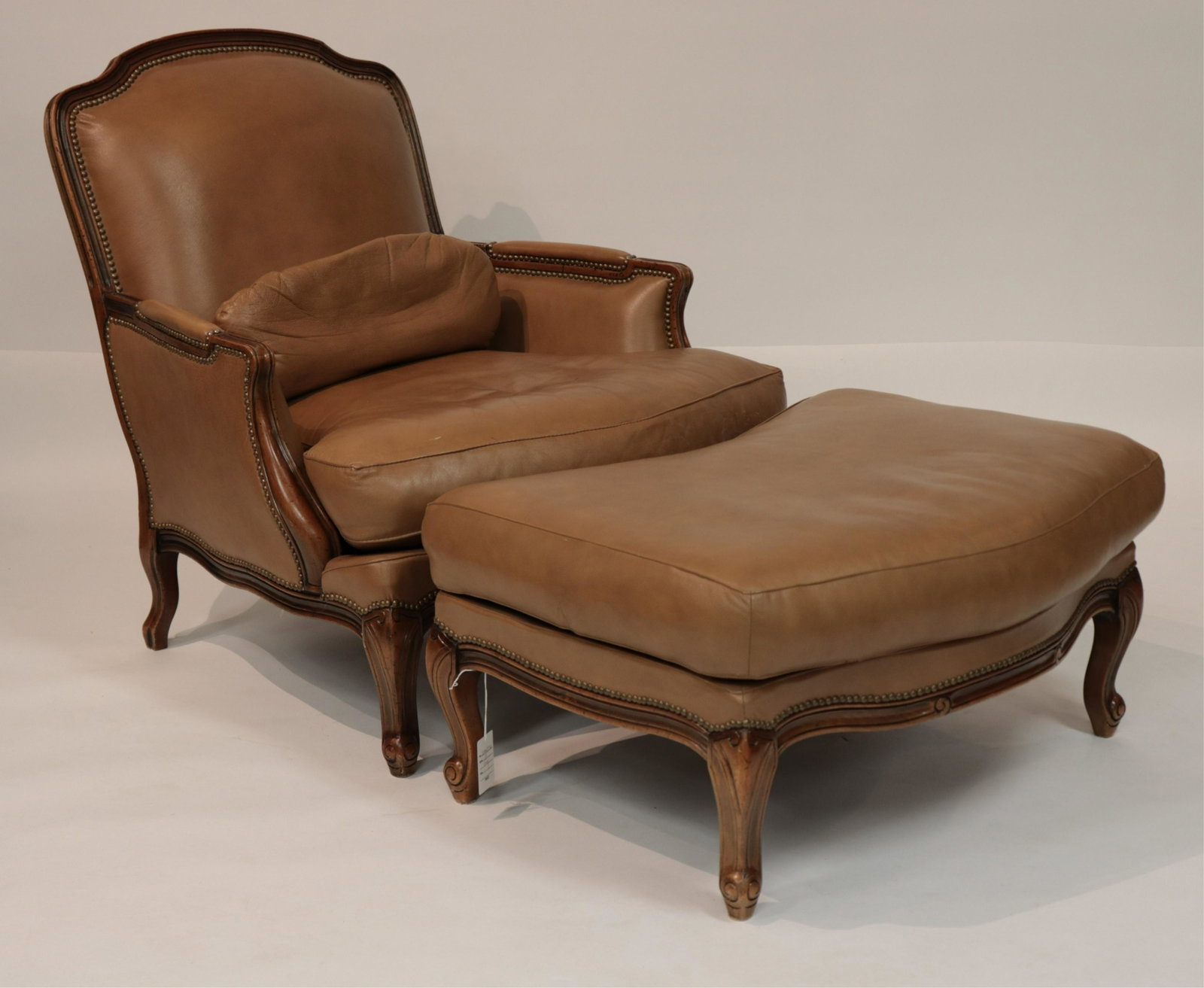 Louis XV Style Chateau D'Ax Chair and Ottoman: Louis XV French Provincial Style Wood and Leather Upholstered Chateau D'Ax Bergere Chair and Ottoman, made in Italy 1994 (SJAM2396/2)(MM) Dimensions: 36 x 34 x 38, ottoman 17 x 35 x 24