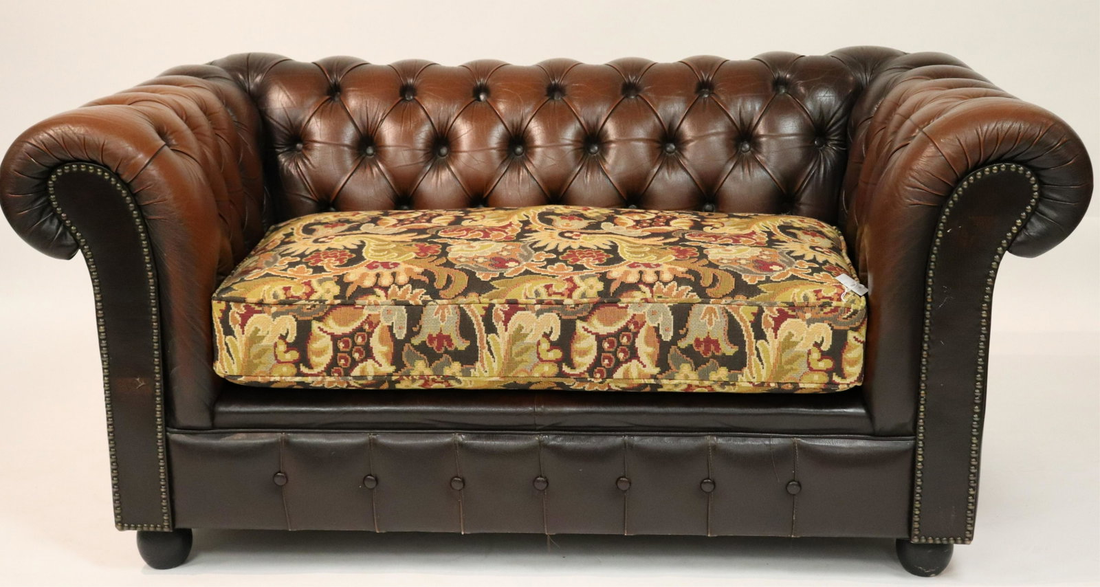 Chesterfield Upholstered Loveseat: Chesterfield Upholstered Loveseat with tapestry style woven fabric seat cushion, oak bun foot (SJAM2612)(MM) Dimensions: 27 1/2"H x 58"W x 34"D