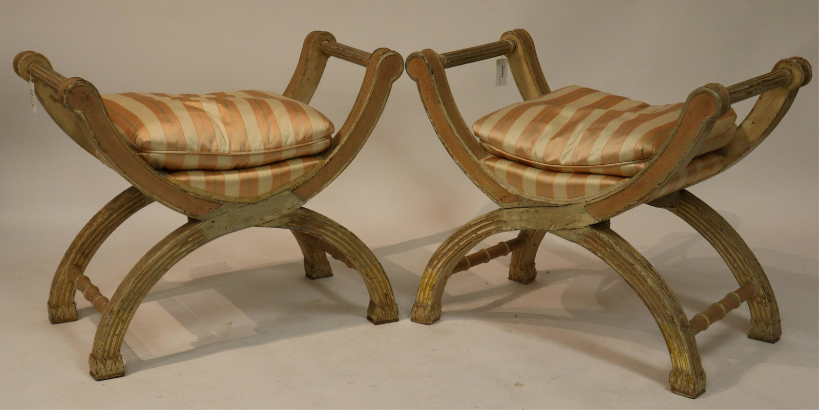 Pair of Neo-Classic Style Curule Form Benches: Pink and cream painted. (DDBR566/2)(MS) Dimensions: 27.75 H x 33.5 W x 18.5 D