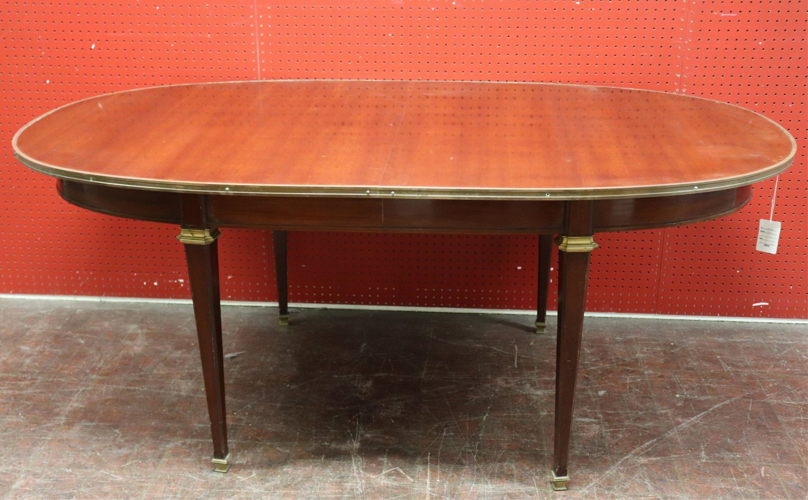 Louis XVI Style Gilt Brass Mounted Dining Table: Louis XVI Style Gilt Brass Mounted Mahogany Dining Table, attributed to Jansen (NJWA314)(MS) Dimensions: 28 1/4" H x 42" W x 71 1/2" L Property from the Estate of an Important New York Modernism Deale