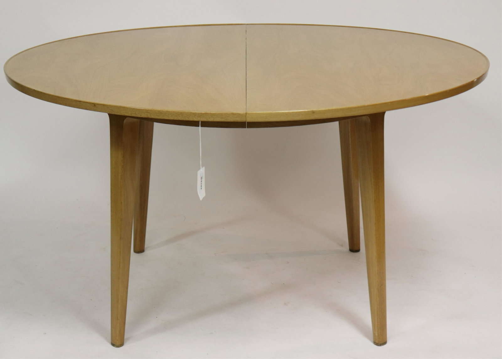 Edward Wormley for Dunbar Extension Dining Table: Edward Wormley for Dunbar Faded Walnut Extension Dining Table, circa 1960 (NJWA117)(MS) Dimensions: 29 1/2" H x 54" Dia., 69" Ext. including one leaf Property from the Estate of an Important New York 