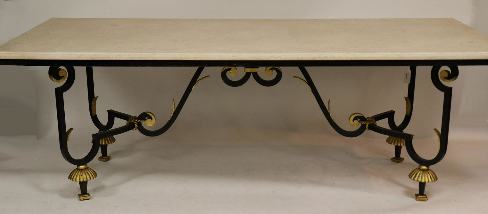 Gilbert Poillerat Style Parcel-Gilt Dining Table: Gilbert Poillerat Style Parcel-Gilt Wrought Iron Dining Table, with travertine top (NJWA118)(MS) Dimensions: 29 1/2" H c 42" W x 87" L Property from the Estate of an Important New York Modernism Deale