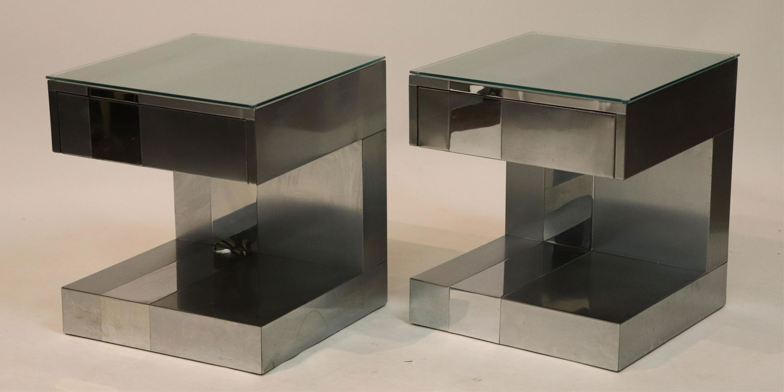 Pair of Paul Evans Style Side Tables: Pr. of Paul Evans Style Side Tables, finished along backside as well, cantilever shape one drawer, glass tops (RORS2650/2)(MM) Dimensions: 22" H x 20" W x 20" D