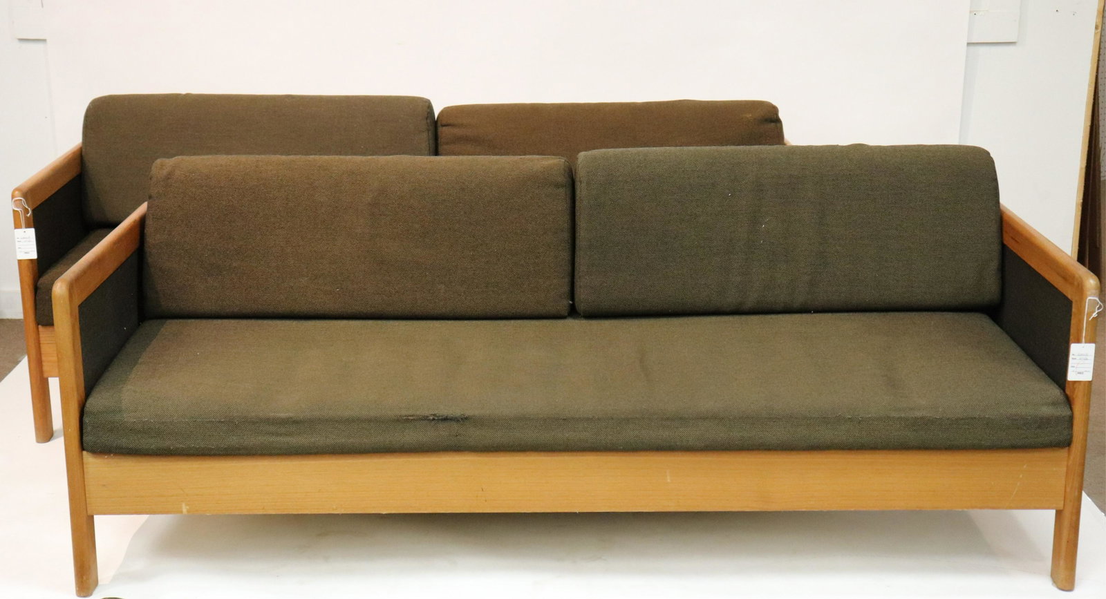 Pair of Danish Modern Teak Sofa by Hestback c 1975: Upholstered in coffee colored woven wool (QMOST694/2)(MS) Dimensions: 25 H x 77 W x 32.25 D