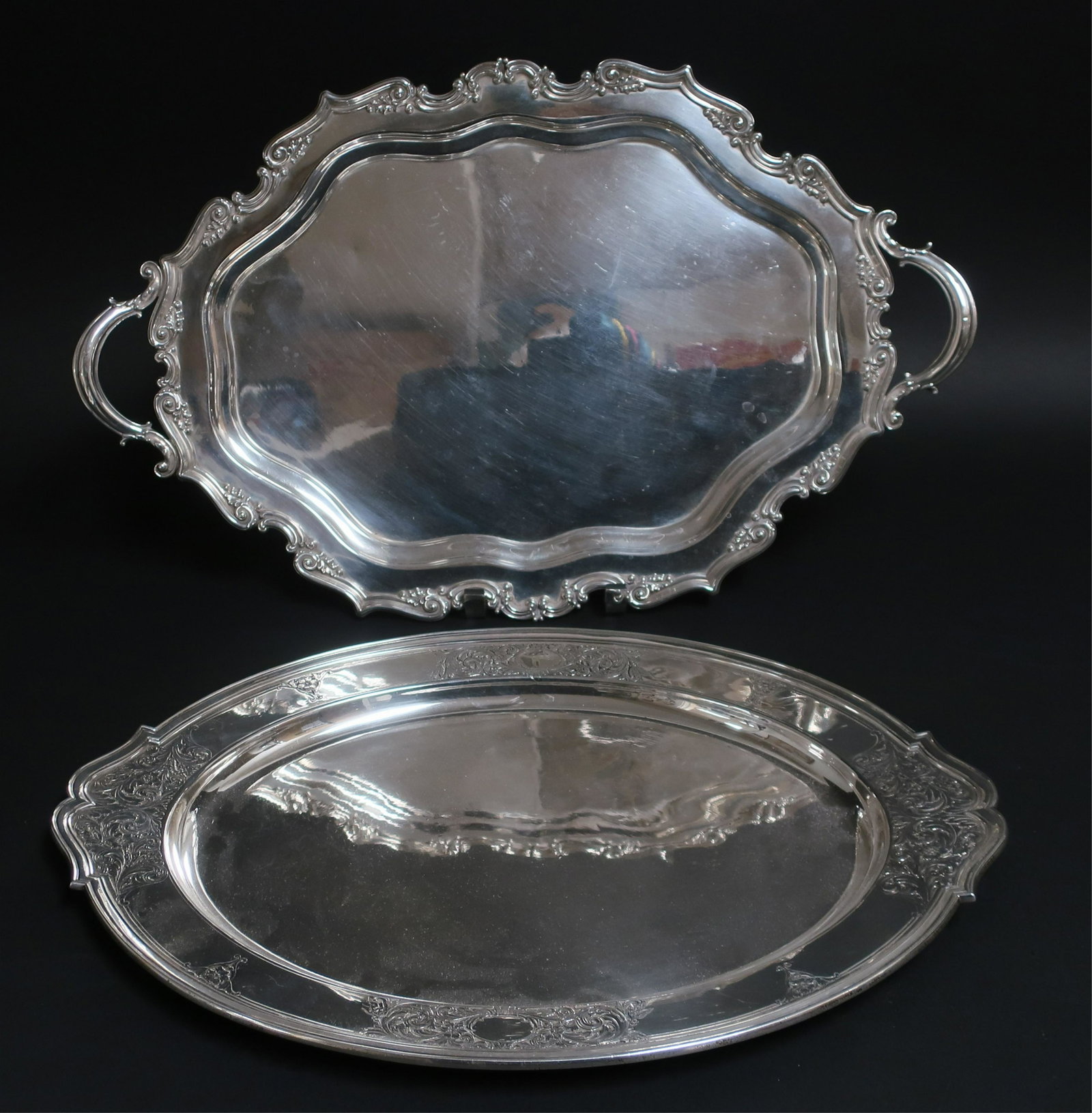 2 Gorham Sterling Silver Tray/Platters: 2 Gorham Sterling Silver Tray/Platters, the tray extensively engraved on the reverse, the oval platter with floral and leaf scroll engraving, 97 ozt. (2 pc.) (SPAR2402/2)(WT) Dimensions: 22" x 14" to 