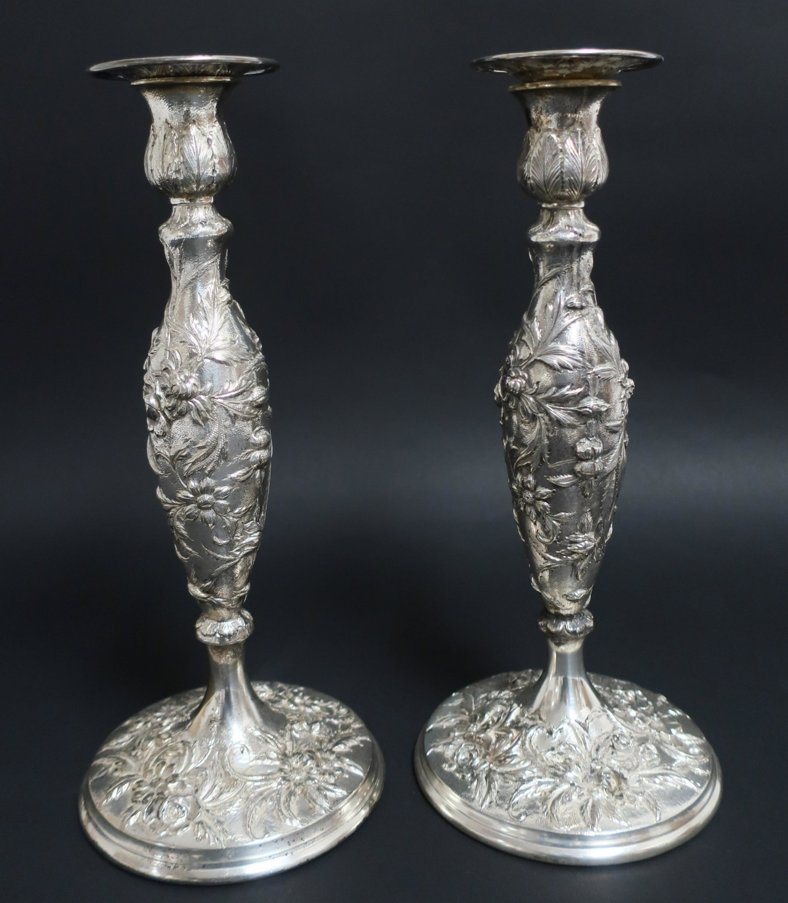Pair of Samuel Kirk Sterling Floral Candlesticks: Samuel Kirk & Son Baltimore, Pair Sterling Silver hand repoussed floral candlesticks with original matched sterling bobeches, late 19th C., all pieces marked including #108, weighted, gross troy ounce