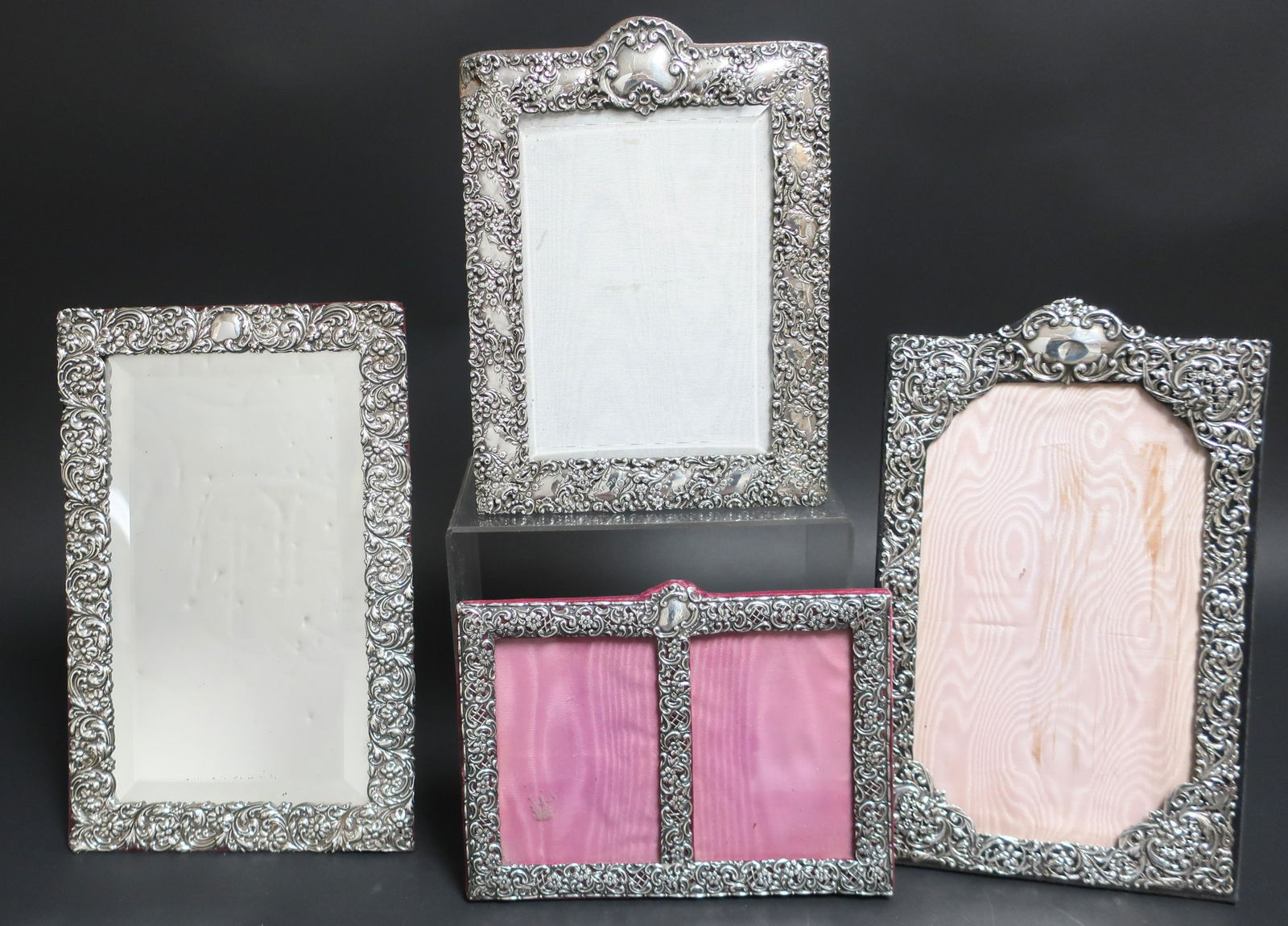 4 Sterling Silver Frame Mirror/Photo Frames: 4 Sterling Silver Frame Mirror/Photo Frames, English, etc., all repousse, one reticulated, double frame monogrammed and dated 31-1-71-96 (4 pc.) (SPAR2404/4)(WT) Dimensions: 7 1/2" x 10" to 14" x 9" P