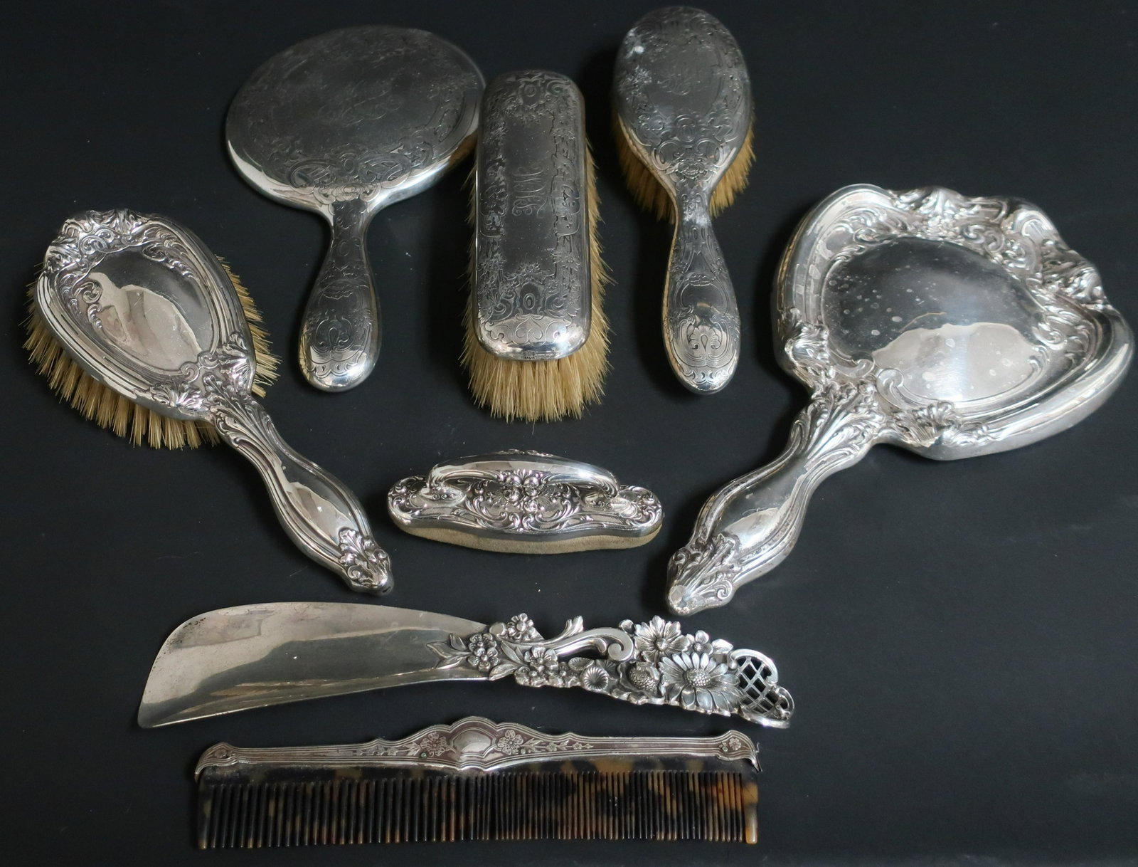 8 Sterling Silver Dressing Table Articles: 8 Sterling Silver Dressing Table Articles, includes Redlich shoehorn with raised & pierced floral handle (8 pc.) (SPAR2426/8)(WT) Dimensions: Horn 9 1/4" L Property from a major private collection of 
