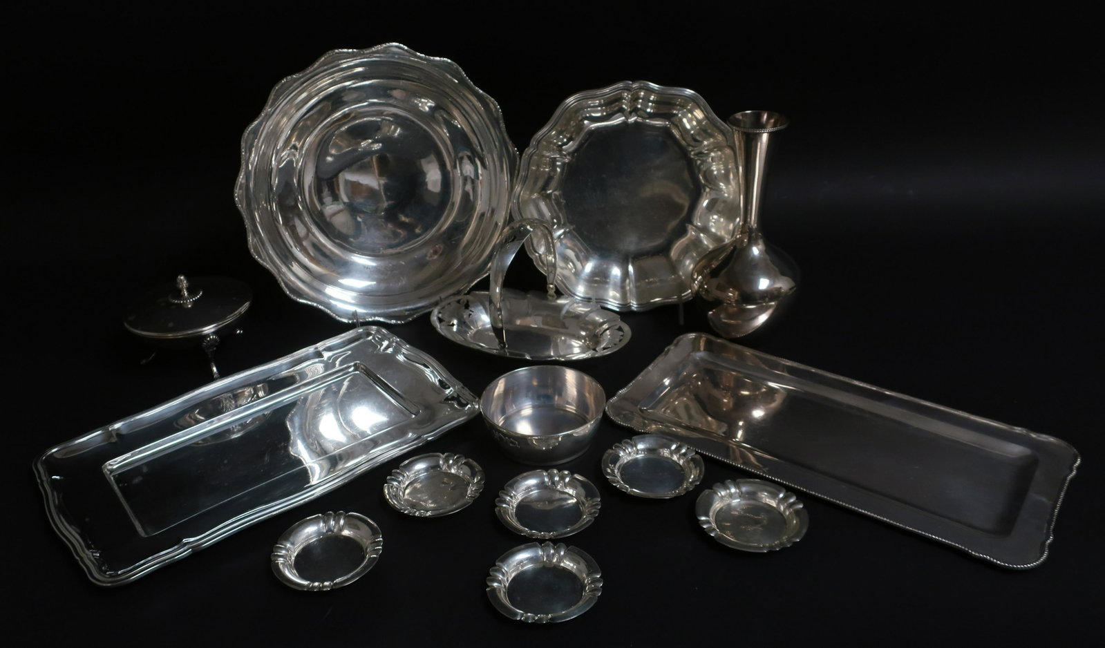 14 Pieces .800 Silver, Bowls, Trays & Dishes: 14 Pieces .800 Silver, Bowls, Trays & Dishes, 111.41 ozt (14 pc.) (WECH2454)(WT) Dimensions: Largest tray 14" x 9", vase 9 1/4" H, nut dishes 3 1/4" dia., largest bowl 2 3/4" x 12" dia.