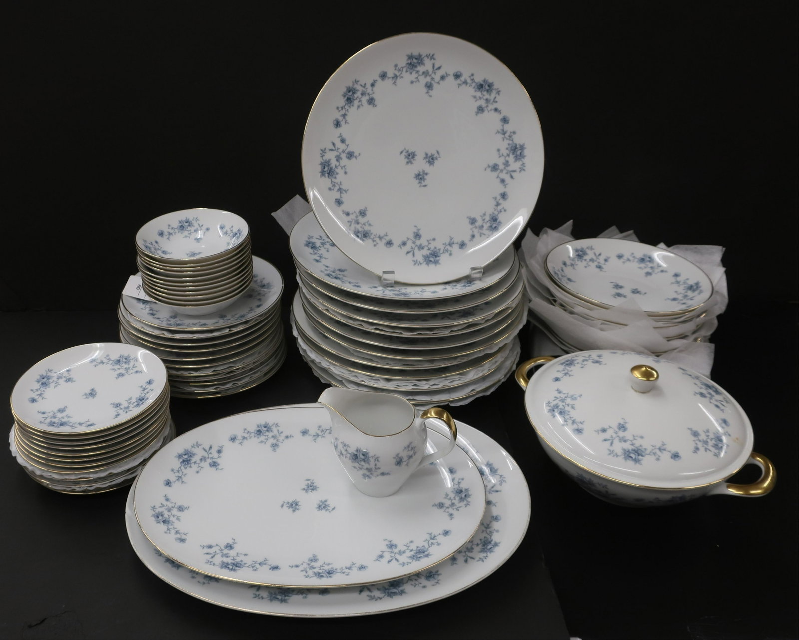 Bavarian Porcelain Dinner Service for 11: Bavarian Porcelain Dinner Service, 5-piece place settings for 11, blue/grey flowers, casserole, 2 platters, 1 creamer (lot) Dimensions: Dinner 10 1/2" Dia., largest platter 15" L, chipped, one 7 1/2" 