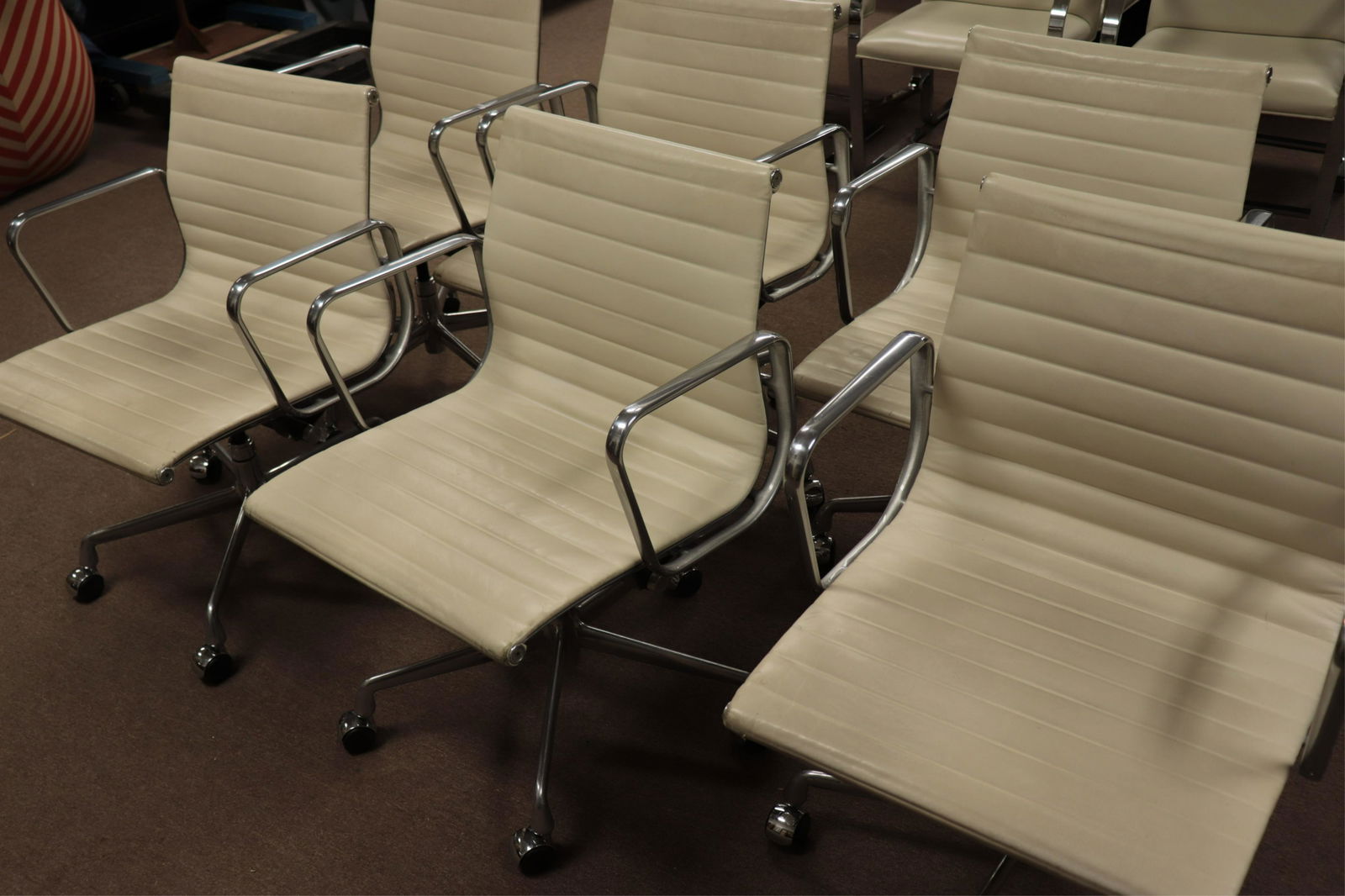 Set of 6 Eames for Herman Miller AG Office Chairs: Cast aluminum frame, ribbed leather upholstery, adjustable swivel base on casters. (TWTO86/6)() Dimensions: 34 h by 23 w by 24 d