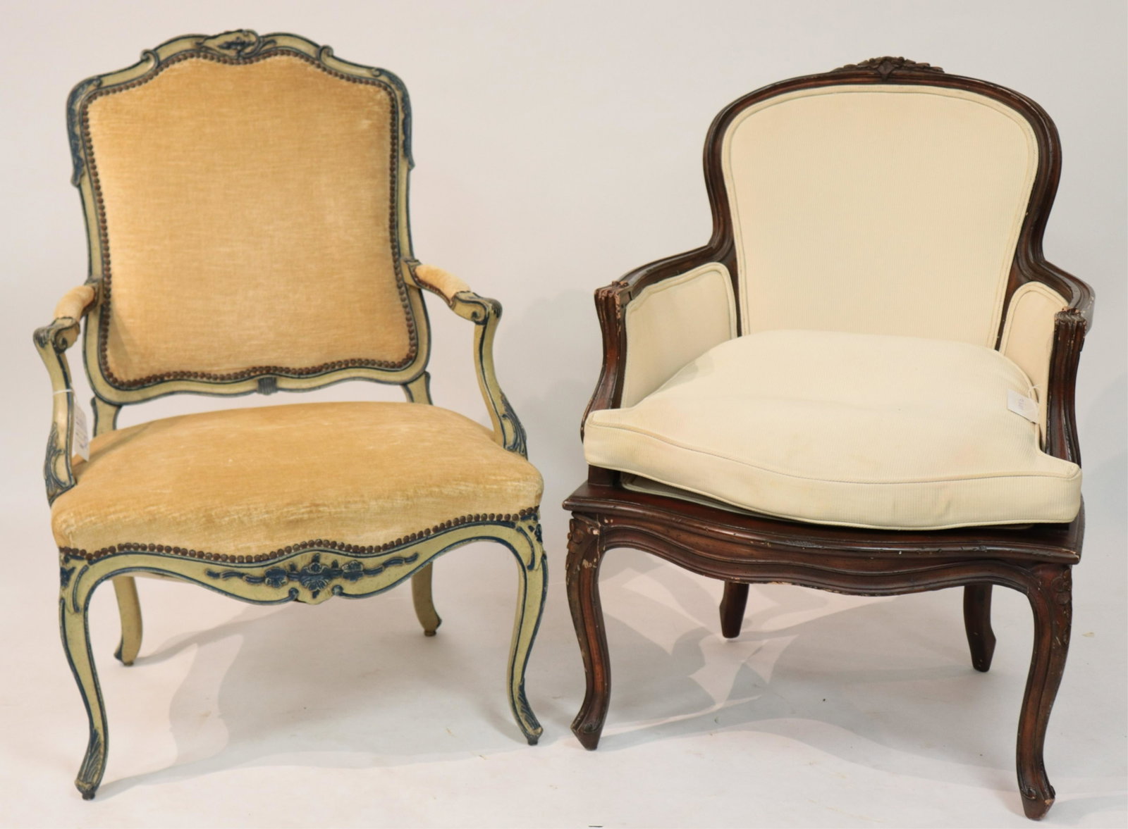 Louis XV Style Fauteuil and Bergere: Fauteuil with a W. & J. Sloane Inc. (NYC) label, carved wood frame with antiqued painted finish in cream and blue, light gold/beige velvet upholstery with outlining nailheads. Bergere with carved wood