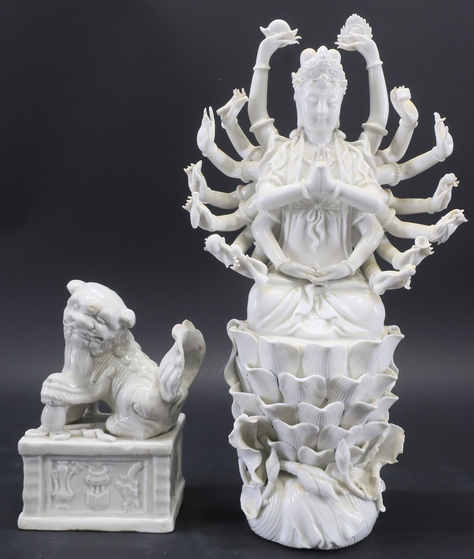 Chinese Blanc-de-Chine Porcelain Multi-Armed Guany: Well detailed slip cast and molded figure of a multi-armed Guanyin seated in dhyanasana holding Buddhist attributes in each extended hand. She sits atop a high-pedaled lotus base, The bottom is marked