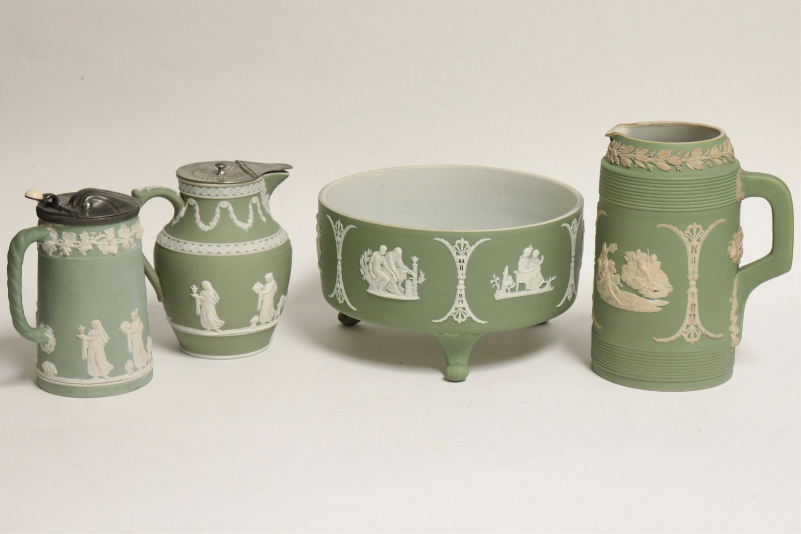4 Wedgwood Green Jasper Dip Pitchers/Bowls: 4 Wedgwood Green Jasper Dip Pitchers/Bowls, impressed mark & 2 with England (4 pc.) Part II from a major collection of Wedgwood, Long Island, NY Dimensions: Bowl 5" H x 8 1/2" dia. (ZWED4521/4)(WT)