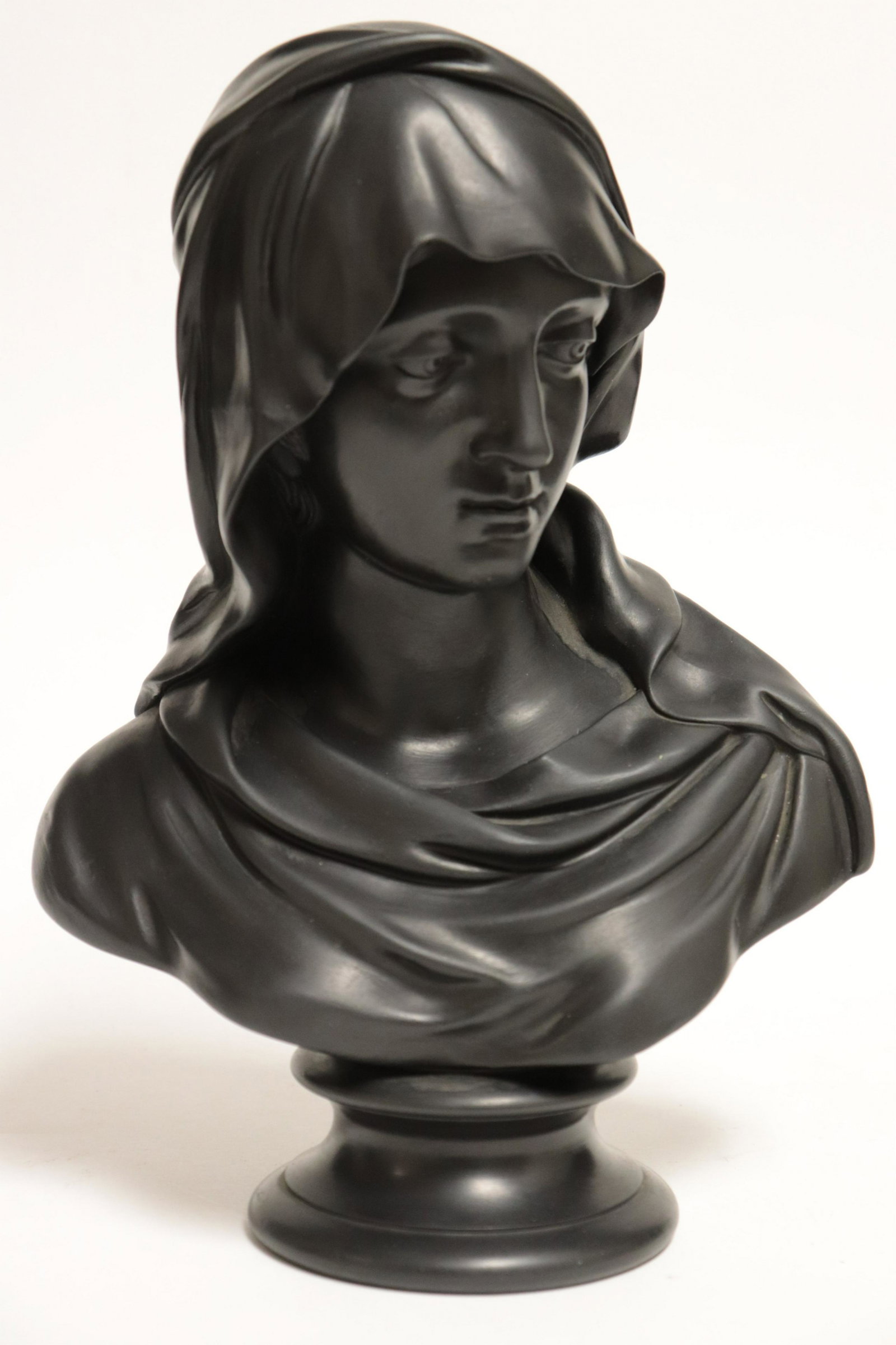 Wedgwood Black Basalt Bust of Madonna: Wedgwood Black Basalt Bust of Madonna, impressed mark, bolted to a socle Part II from a major collection of Wedgwood, Long Island, NY Dimensions: 11 11/4" H x 8" W (ZWED4664)(WT)