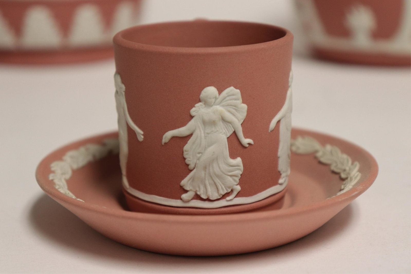 5 Terracotta Jasperware Wedgwood Items: 5 Terracotta Jasperware Wedgwood Items, planter, covered jar, demitasse & saucer, creamer & pin tray, all with raised Classical decoration, impressed mark & Made in England (5 pc.) Part II from a majo
