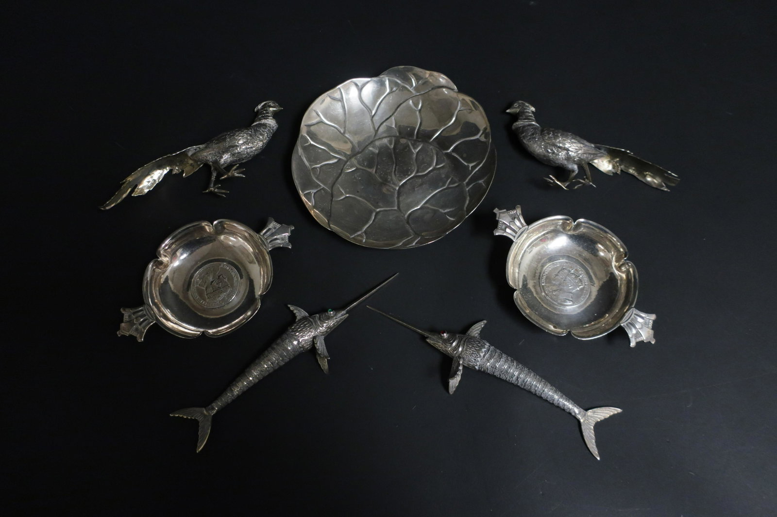 Seven Silver Pieces, Tiffany & others: Tiffany dish, pair English small dishes by R.E. Stone, pair .835 silver gilt pheasants, and pair Spanish .800 silver reticulated sword fish. 18.21 OZT. Dimensions: Tiffany: 6 DIAMSword: 7 L Property f