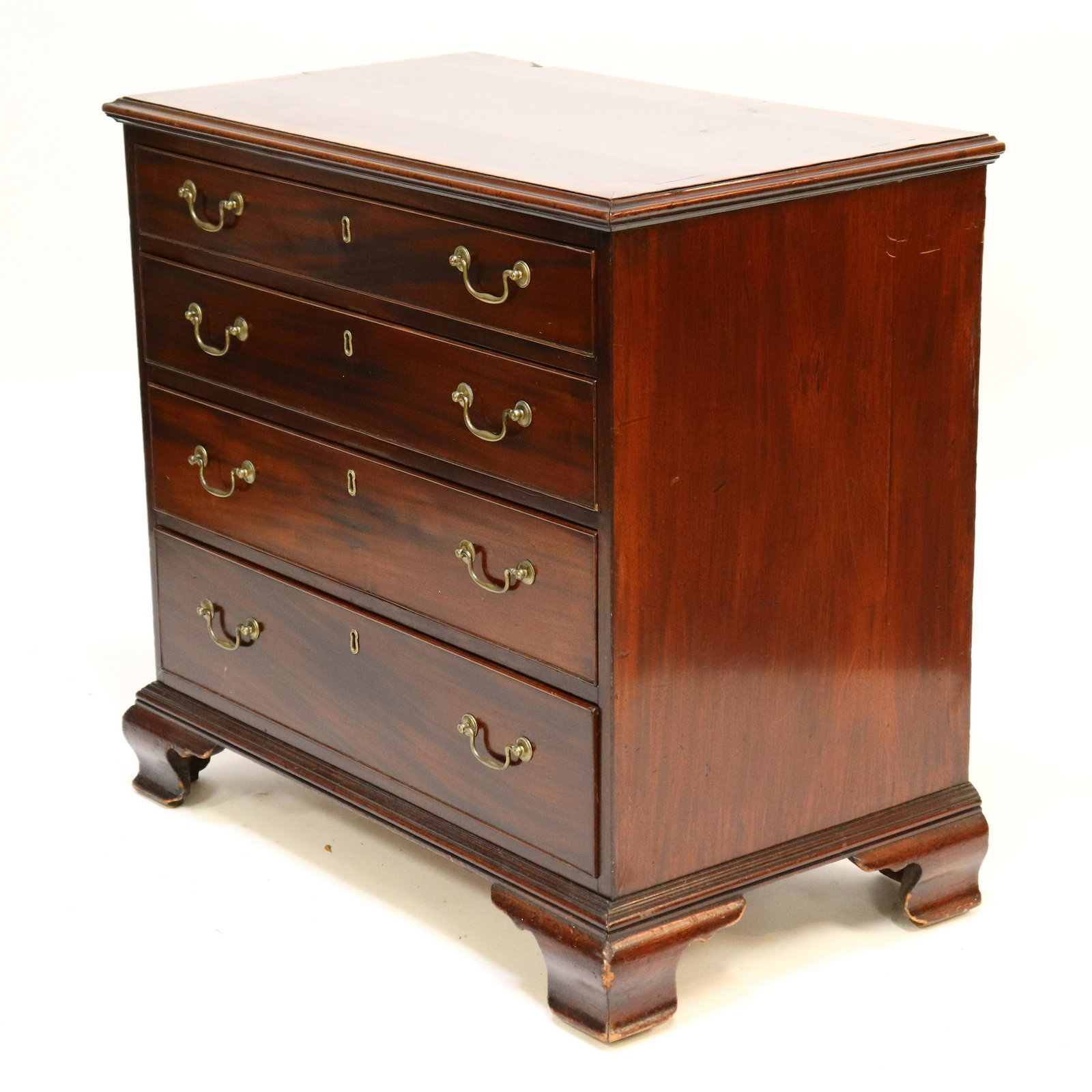 George III Mahogany Bachelors Chest: George III Mahogany Bachelors Chest, L.18th-E.19th C., top contrast inlaid with rounded corners and flame mahogany,4 beaded drawers Dimensions: 33 x 34 x 20 Property from a West Hartford, CT collectio