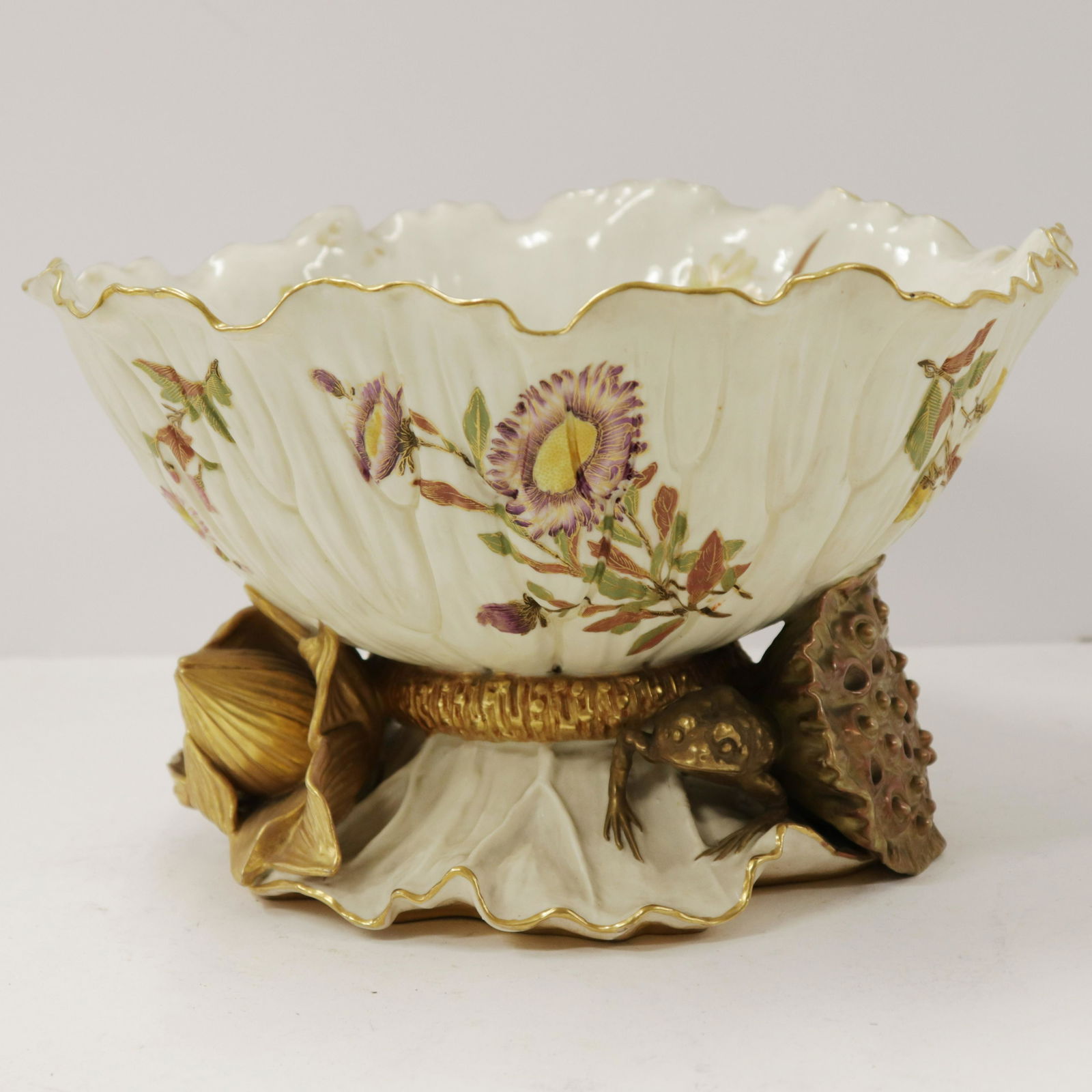 Royal Worcester Art Nouveau Centerpiece: Royal Worcester Art Nouveau Porcelain Centerpiece Bowl with frog, lily in high relief Dimensions: 7" H x 11 1/2" W Property from the Estate of Florence (1917-2018) and Judge David Edelstein (1910-2000