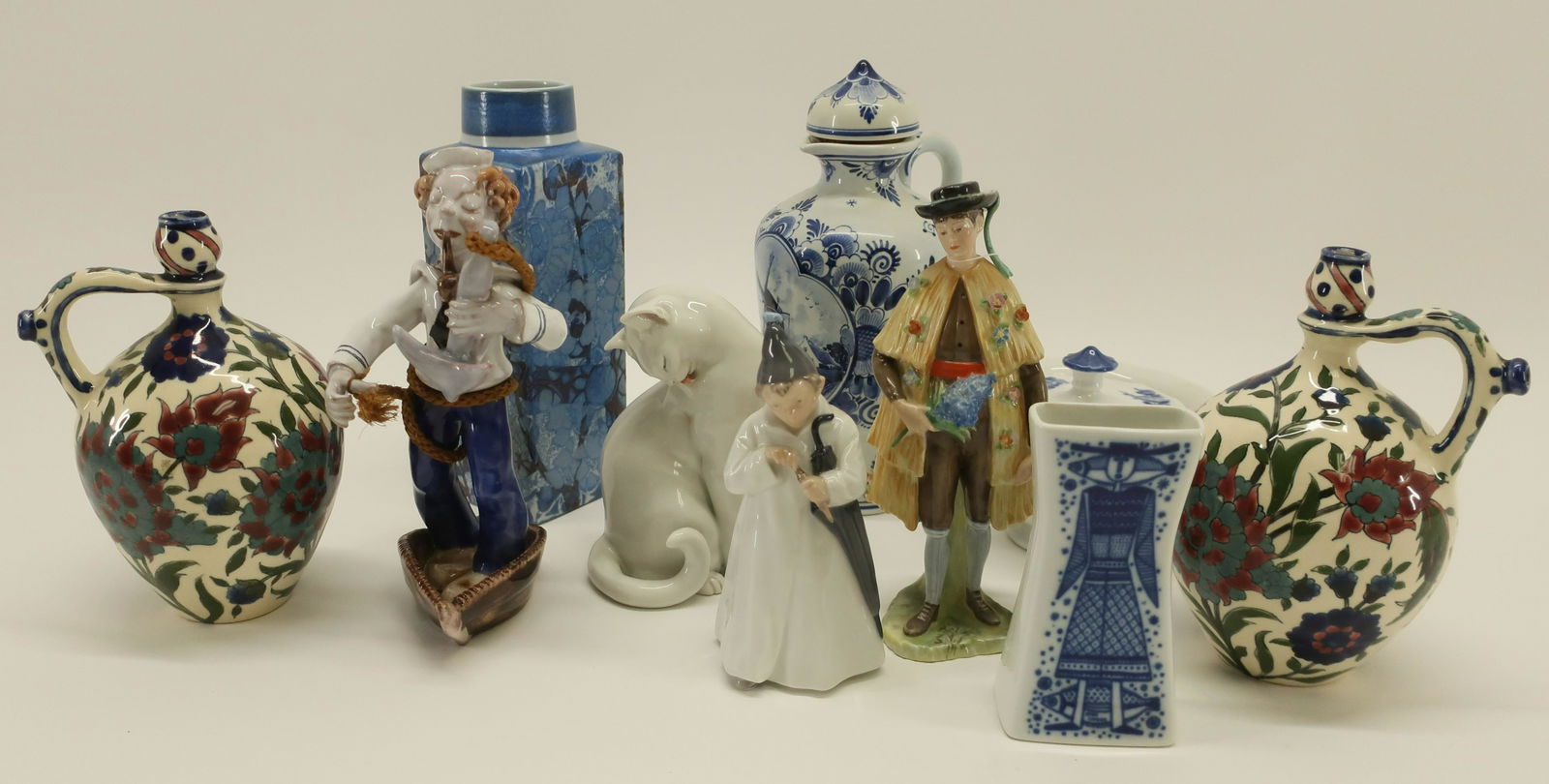 10-pc. N. European Porcelain/Pottery & Faience: 10 Pieces Large Northern European Porcelain/Pottery & Faience, comprises: pair Hungarian Zsolnay Pecs jugs, Royal Copenhagen 'Baca' vase signed, Viennese sailor & cat, Royal Copenhagen umbrella boy an