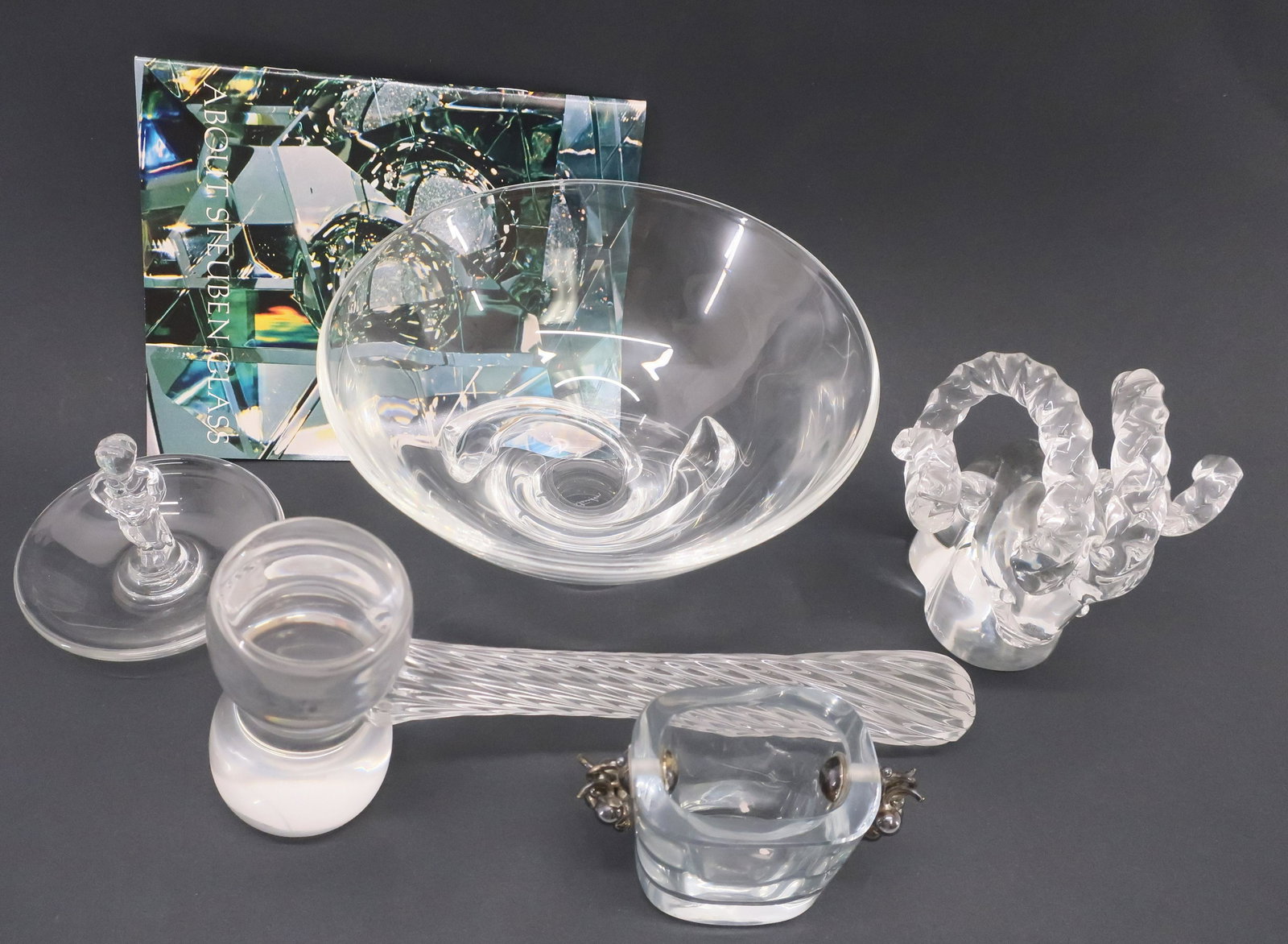 5-Pc Glass, Steuben, Cartier, Val St. Lambert: 5 Pieces Signed Clear Glass, comprises: Steuben bowl, Cartier Ram, Val St. Lambert boy & gavel, Strohmberg small vase with silverplate grape handles Dimensions: Bowl 7" dia., gavel 9" L, vase 2 1/2" H