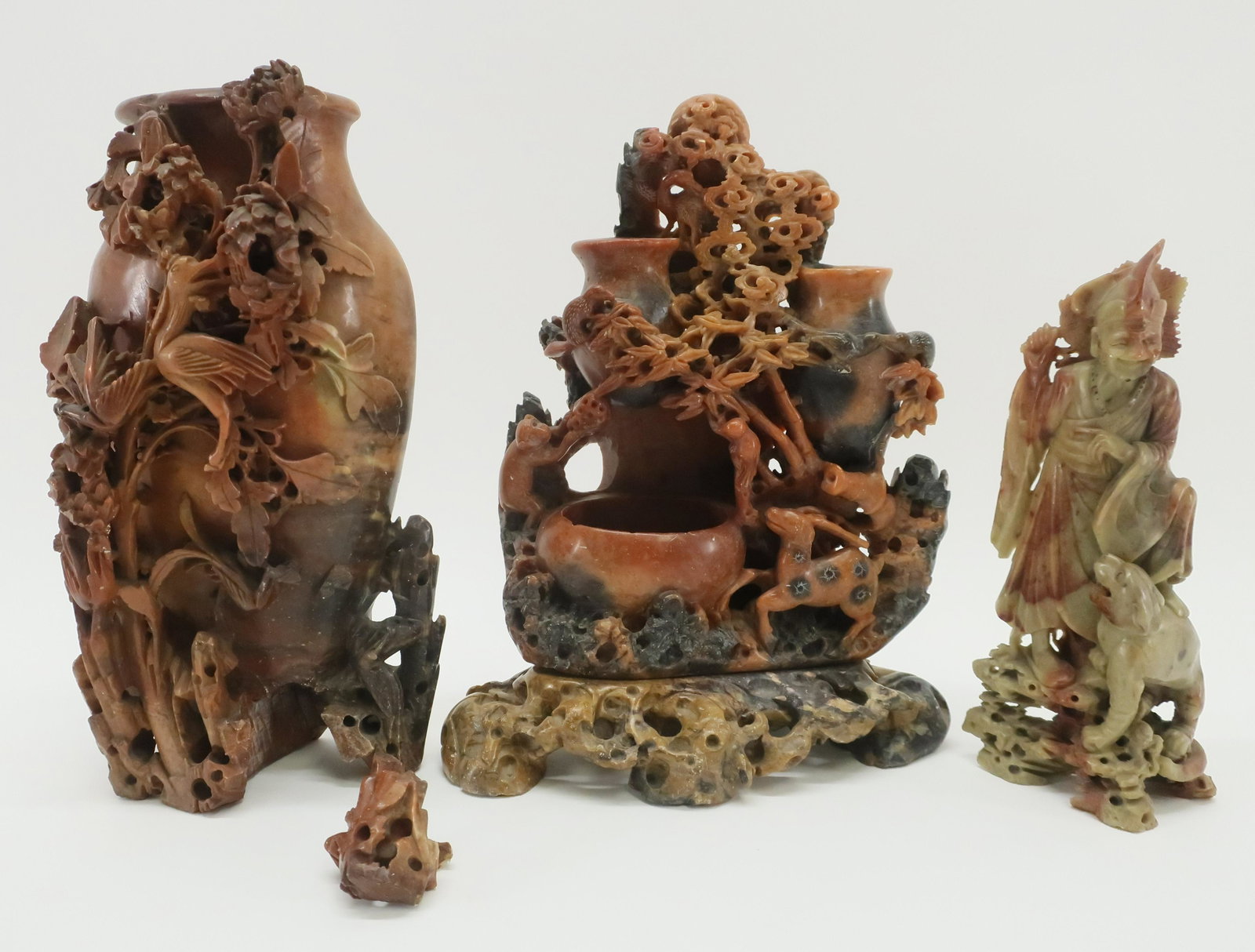 3 Chinese Soapstone Carvings: 3 Chinese Soapstone Carvings, a figure, large vase and a cluster of 3 small vases Dimensions: Tallest 10 1/2" Property from a Litchfield collection (ESCR6529/3)(WT)