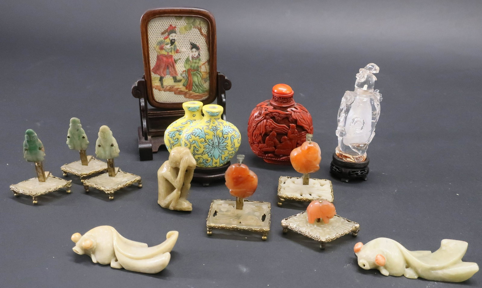 Group of Small Chinese Items: Group of Small Chinese Items, comprises: 6 hardstone place card holders, cinnabar snuff bottle, painted table screen, glass snuff bottle, porcelain double snuff bottle, 3 soapstone fish/monkey Dimensi