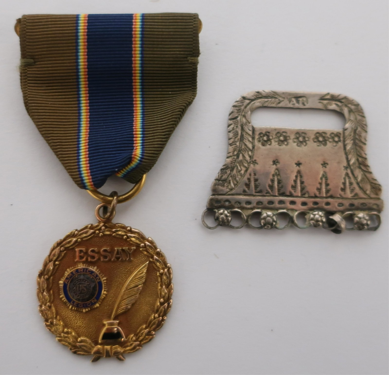 2 Medals, 10k Gold & Silver: 2 Medals, American Legion 10K gold filled "Essay" medal and a silver pendant, maker's mark AR (2 pc.) Dimensions: Legion: 2 3/4" with ribbon (LCA1285/2)(WT)