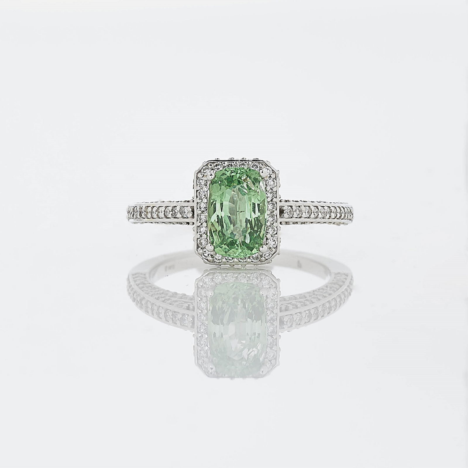 1.08 ct Oval Cushion Cut Tsavorite & Diamond Ring: Tsavorite measuring 8.21 x 5.50 x 3.42 mm; 1.08 ct. With 124 diamonds (unweighed) and two bezel set diamonds (weighing 0.02 ct) Set in 14k white gold. Gross weight 3.8 grams. Dimensions: Size 7.25 Pro