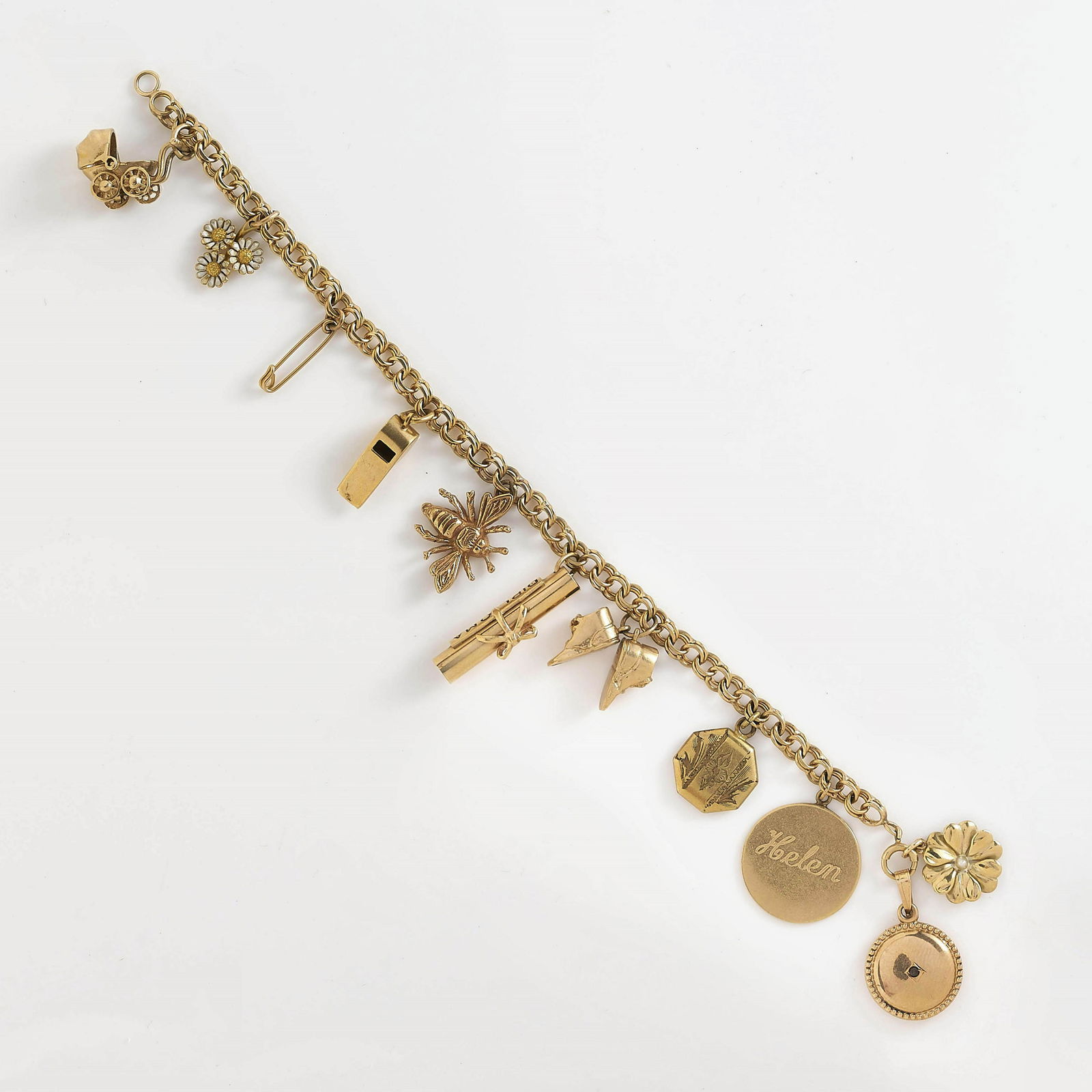 14K Yellow Gold Charm Bracelet: A vintage 14k yellow gold, Prince of Wales link bracelet with charms including vintage baby carriage, group of three daisies, safety pin, whistle, bee, diploma, baby shoes, etc. Marked charms include