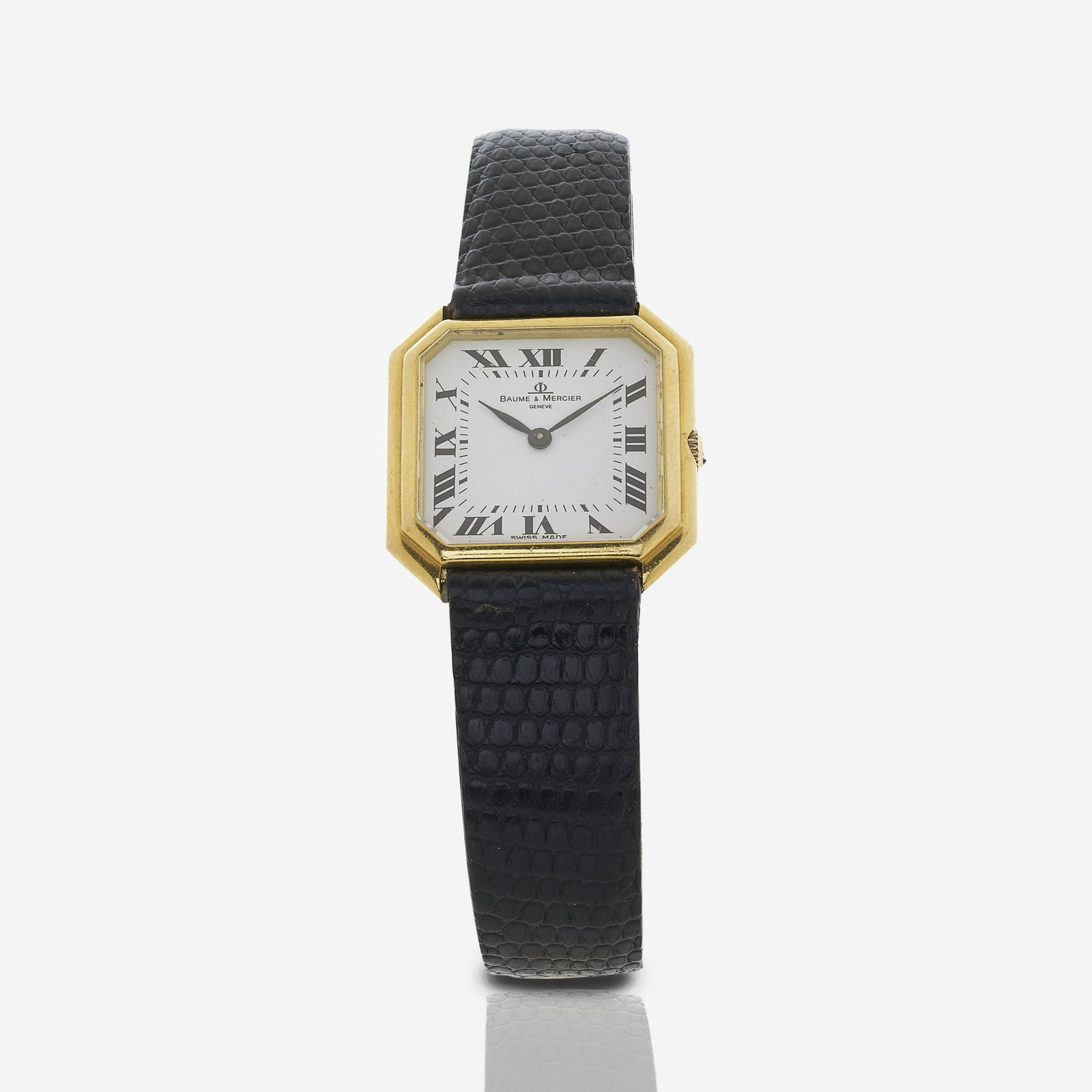Ladies Baume and Mercier 18k Watch: Baume and Mercier octagonal wrist watch. 18k yellow gold case, white face with Roman numerals. Reference number 38260, serial number 659569 Dimensions: 16.75 mm lug to lug, 26 mm across face Property 