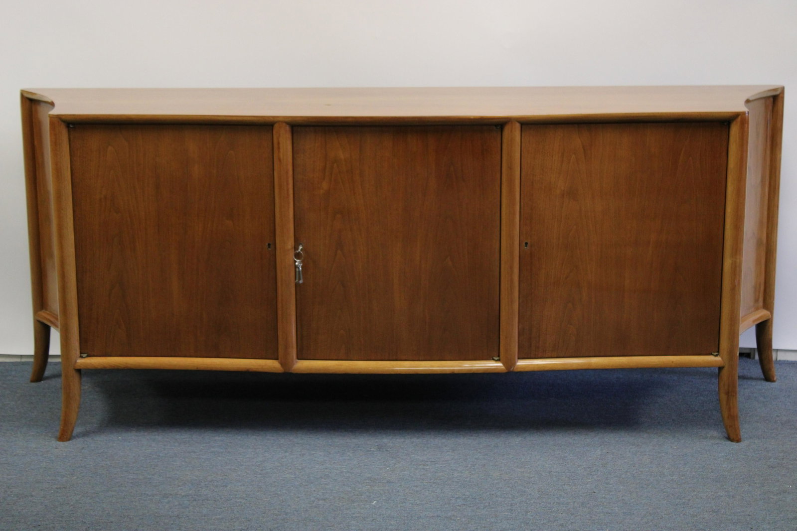 T.H. Robsjohn-Gibbings for Widdicomb Sideboard: T.H. Robsjohn-Gibbings for Widdicomb Walnut Sideboard, circa 1950 Dimensions: 32 1/4" H x 79" W x 22" D Property from the Estate of an Important New York Modernism Dealer. (NJWA160)(MS)