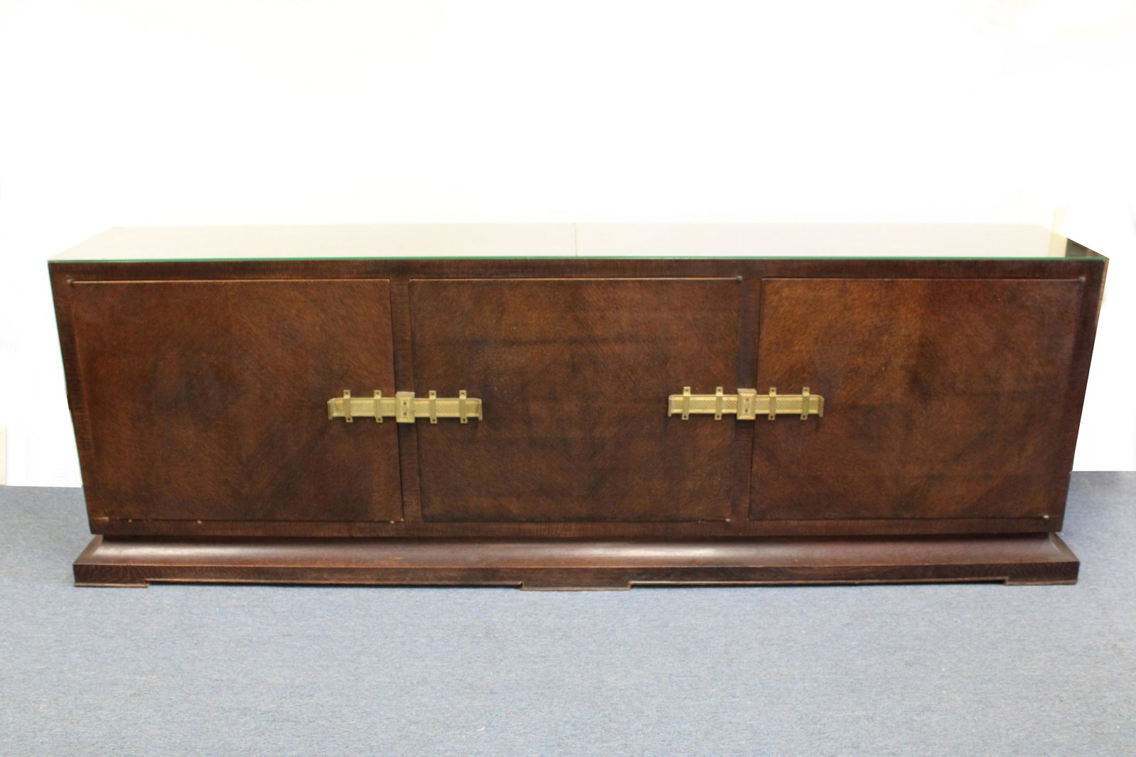 Early Tommi Parzinger Oak Cabinet: Early Tommi Parzinger (for Parzinger) Banded Oak Cabinet Dimensions: 31 1/2" H x 94" W x 15" D Property from a South Kent, CT collector. (JOHN678)(MS)