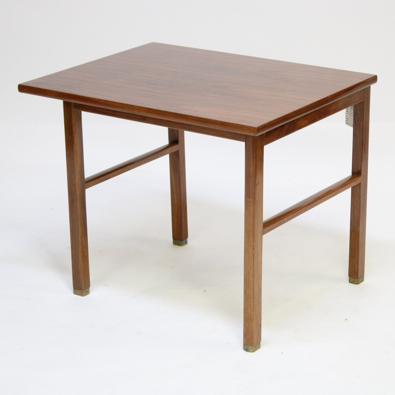 Edward Wormley for Dunbar Walnut Side Table: Edward Wormley for Dunbar Walnut Side Table, circa 1960, with brass feet Dimensions: 22 1/4" H x 28" W x 22" Property from the Estate of an Important New York Modernism Dealer. (NJWA567)(MS)
