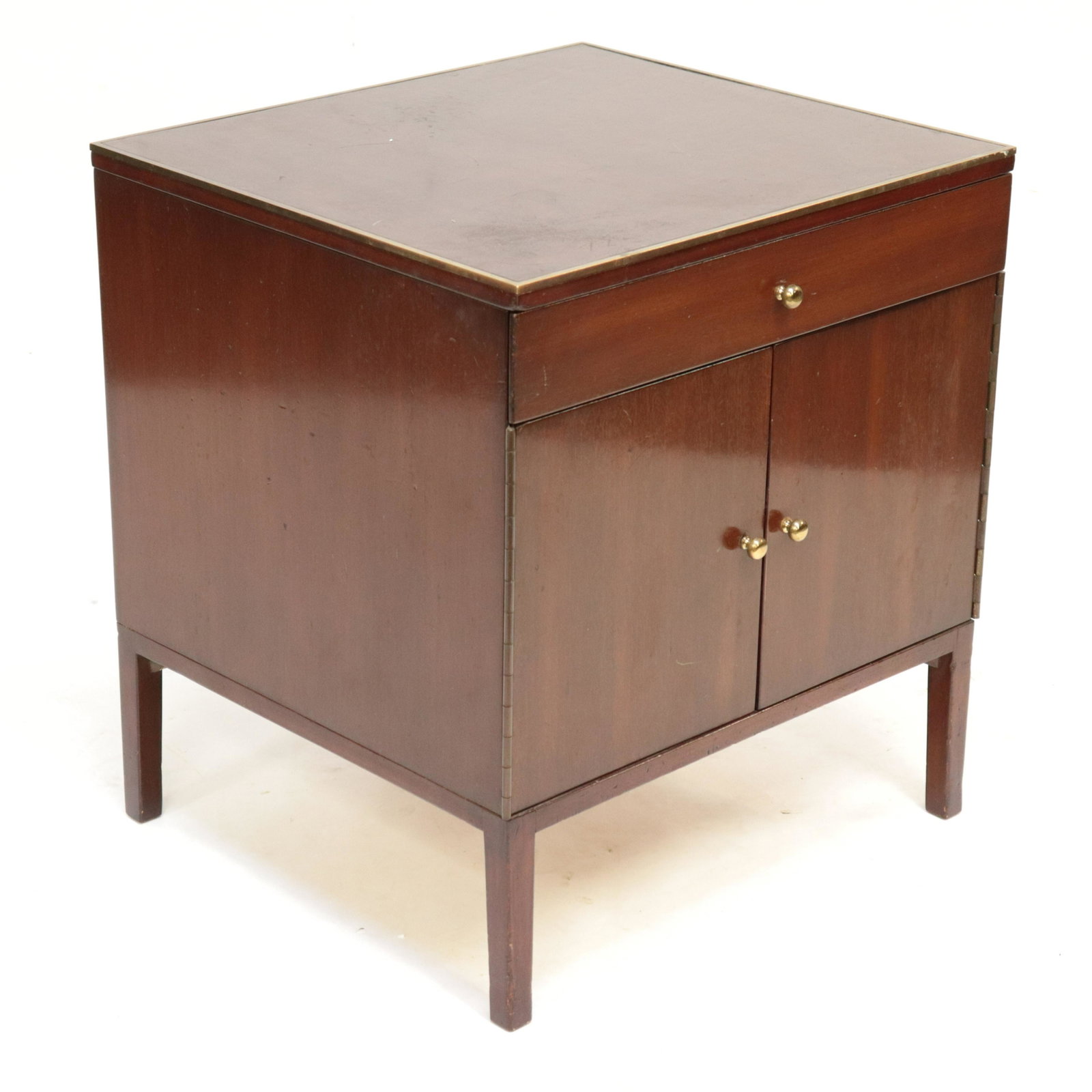 Paul McCobb Small Bedside Cupboard, Irwin Collection: Paul McCobb Small Cupboard, Mahogany, leather top with brass banding, metal label "The Irwin Collection, Paul McCobb Calvin, Grand Rapids" Dimensions: 24" H x 22" W x 20" D Property from a Northwest C