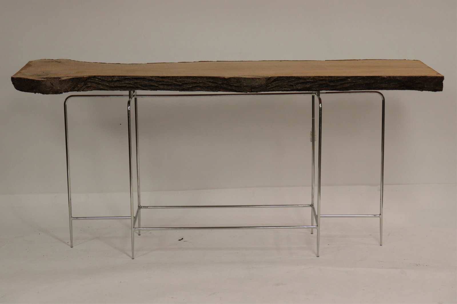 Contemporary Chrome & Maple Live Edge Console: NOTE: this lot is being reoffered due to non paying bidder Julia Otta of New York, NY. Dimensions: 33 3/4" x 73" W x 23" D Property from a West Hartford, CT collection (MORT262)(MS)