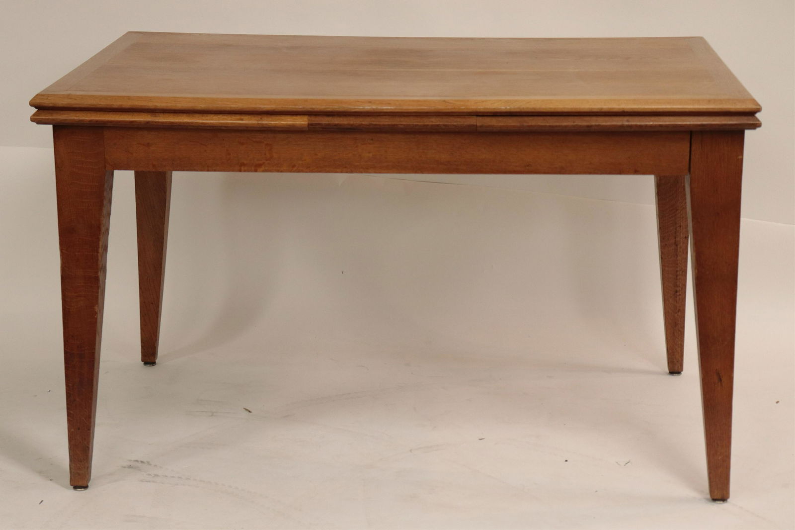 French Mid Century Oak Extension Dining Table: French Mid Century Oak Extension Dining Table in the style of Jean-Michel & Frank Dimensions: 30 3/4" H x 35 1/2"W x 52" L, 102" extended Property from the Estate of an Important New York Modernism De