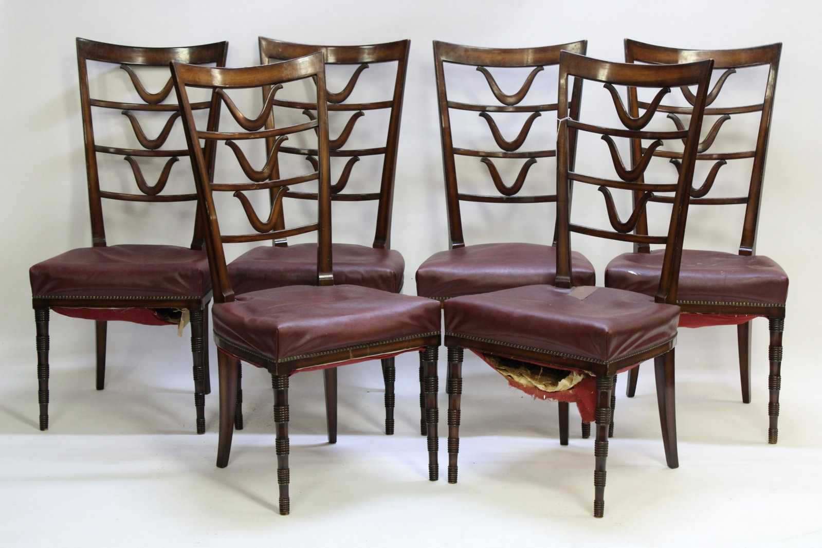 Set 6 Mid Century Italian Mahogany Dining Chairs: Tapered, ring segment turned front legs. Burgundy leather upholstery with brass tack head edging. Dimensions: 42 H x 19 W x 19 D Property from a South Kent, CT collector. (JOHN4/6)(JP)