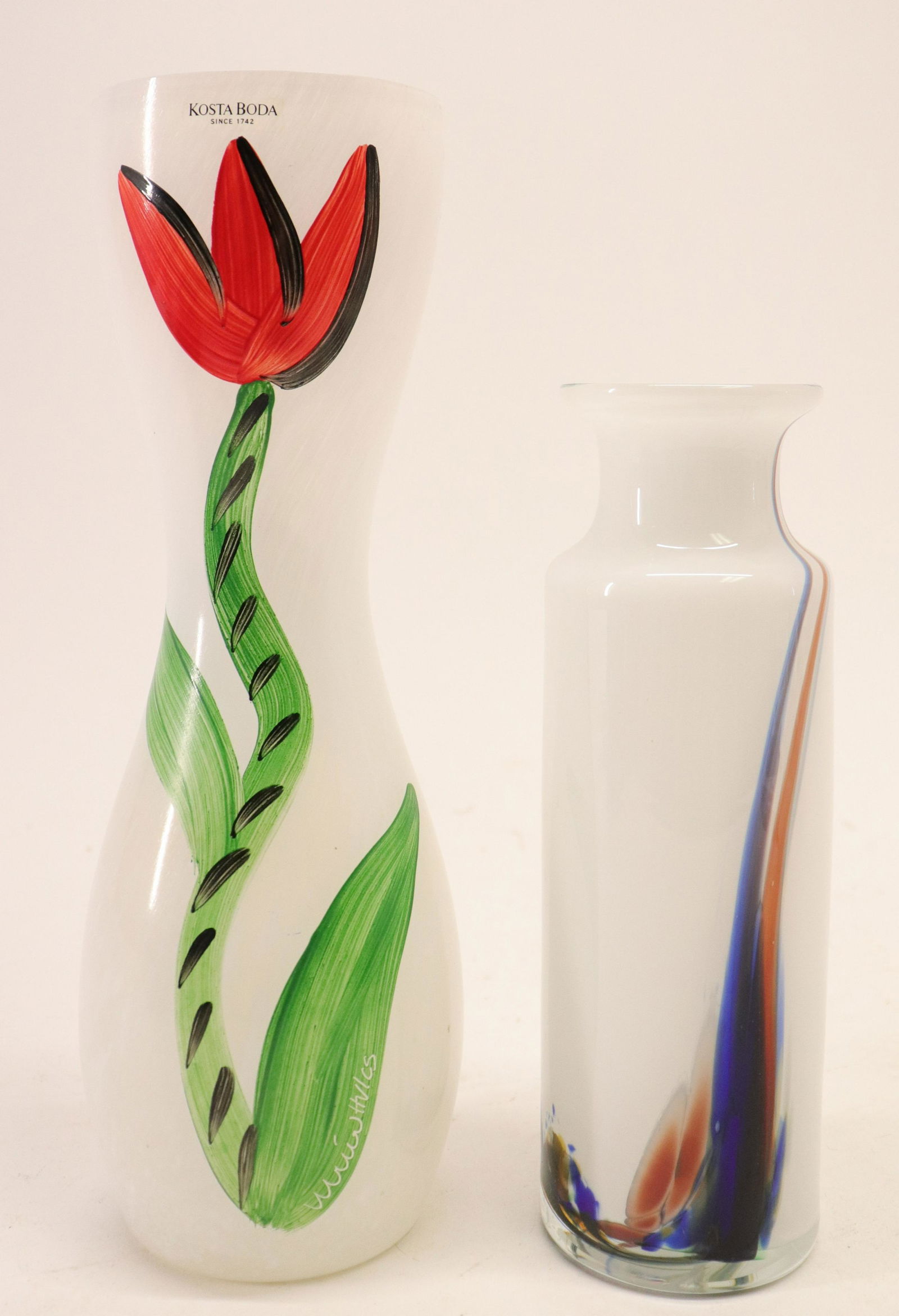 2 Colorful Glass Vases; Lutken, Holmegaard, Kosta: 2 Colorful Glass Vases; Per Lutken for Holmegaard Denmark signed HGq & PL conjoined and Kosta Boda tulip vase by Ulrica Vallien from the cascade series Dimensions: 7 3/4" H and 10 1/4" H Property from