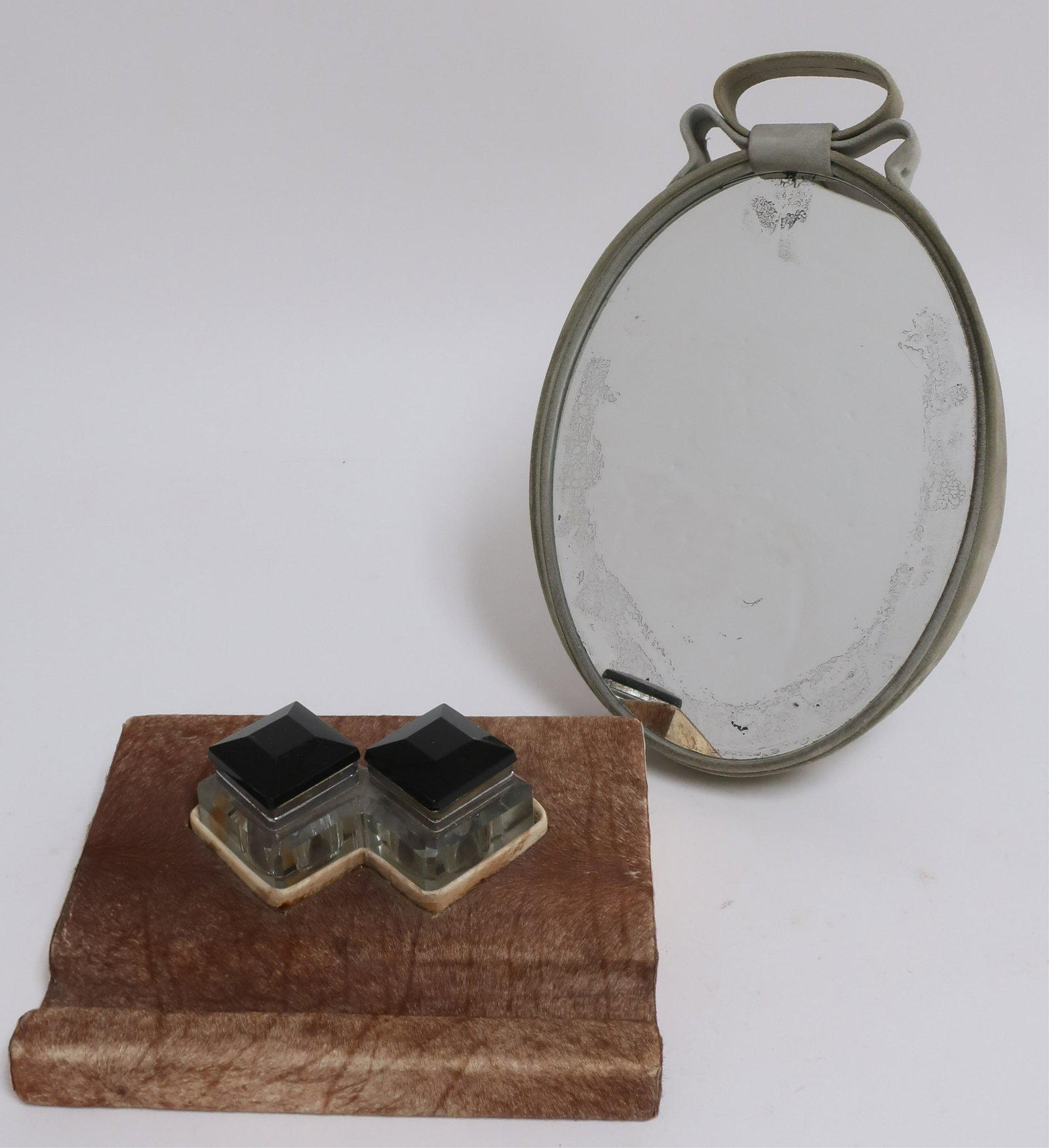 Cowhide Upholstered Inkwell & Mirror: Cowhide Upholstered Inkwell & Celadon Suede Desk Mirror, circa 1930 (2 pc.) Dimensions: Mirror 11" H Property from the Estate of an Important New York Modernism Dealer. (NJWA104/2)(MS)