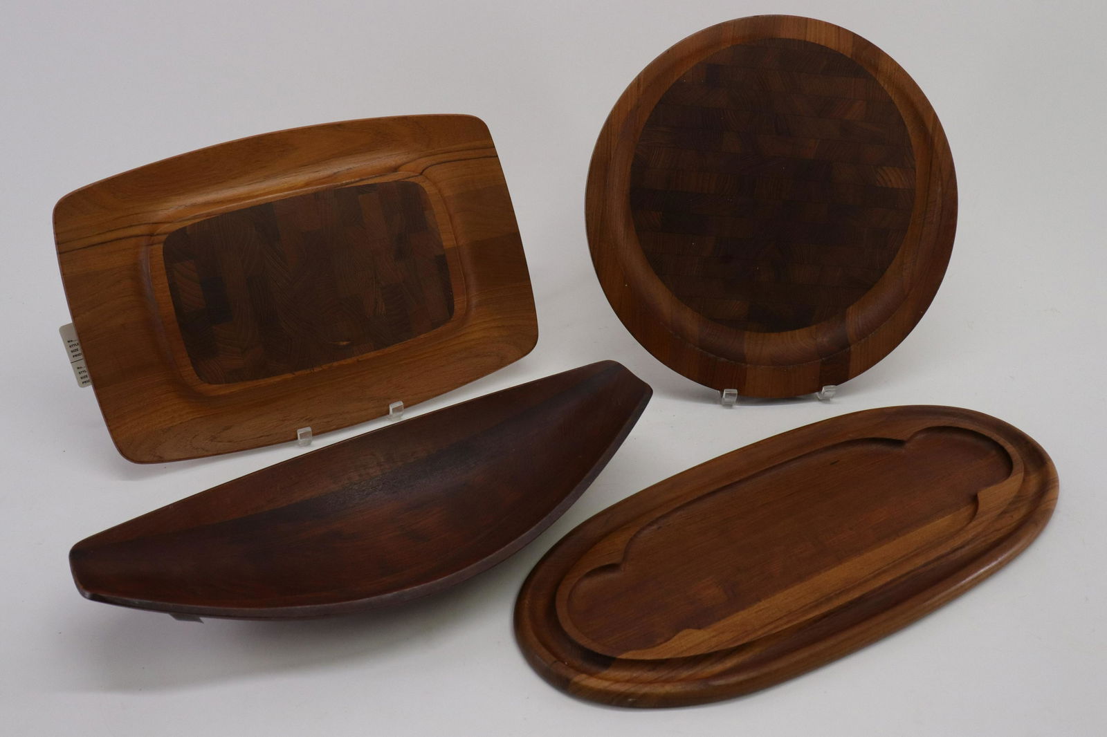 4 Dansk Teak Serving Trays, Jens Quistgaard: 4 Dansk Teak Serving Trays, marked 'JHQ' for Jens Quistgaard Dimensions: Largest 22 1/2", Circular 1 1/2" Dia. Property from the collection of a Massachusetts professor. (STES8081/4)(WT)